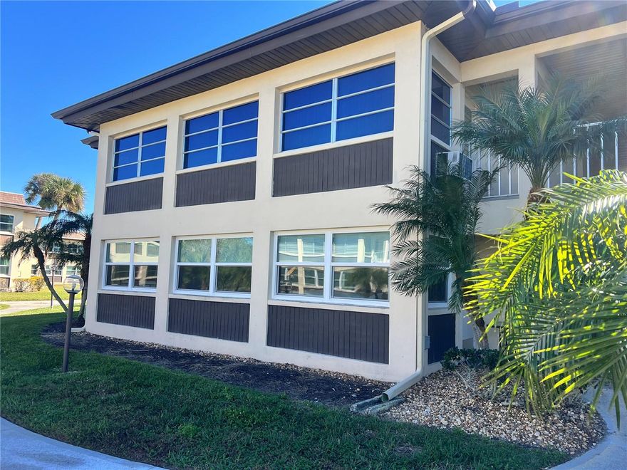 Beautifully Refinished and Updated 2 bedrooms, 2 bathroom ground floor condo located in the highly popular waterfront community of Gulf Harbors. In 2025 Installed: HVAC, Electrical Panel, Hurricane Windows, Plumbing and Sewer brought up to current code.  HOA installed Roof in 2022. FEMA will replace entry doors and new kitchen countertop is scheduled. This wonderful end unit is light and bright and has many features including new luxury vinyl plank flooring throughout, large kitchen with an abundance of solid wood cabinets and counter space, both bathrooms have been tastefully updated. Spacious master bedroom with large walk-in closet and private bath. The unit also comes with its own covered assigned parking space as well as a private exterior storage closet on the same floor. In 2026 HOA will be painting the outside and re-landscaping. This charming community offers three clubhouses, two large pools- one heated and on the waterfront, shuffleboard, BBQ grill areas, bocce ball, billiards, poker tables, fitness, laundry facilities, many scheduled events and 24-hour security. Take an evening stroll along the intercoastal waterway, only steps away, to watch the dolphins and manatees play and see amazing sunsets! The condo fee covers all exterior care, roof, master and flood insurance, basic cable, water, sewer, and trash. For an additional $200 yearly, you have the option to join Gulf Harbors beautiful private sandy beach offering cabanas, pick nick tables and grills located on the Gulf of America and overlooking beautiful Anclote Key! Just a short ride from lively downtown New Port Richey with many restaurants, bars, shops, and Sims Park. Close to all shopping, restaurants, medical needs, Tampa airport and more. A home away from home or living all year around will certainly satisfy your Florida lifestyle. Fantastic opportunity for snowbirds to occupy & rent during the off-season! Come take a look at this spacious, move in ready condo in a community that welcomes all ages.