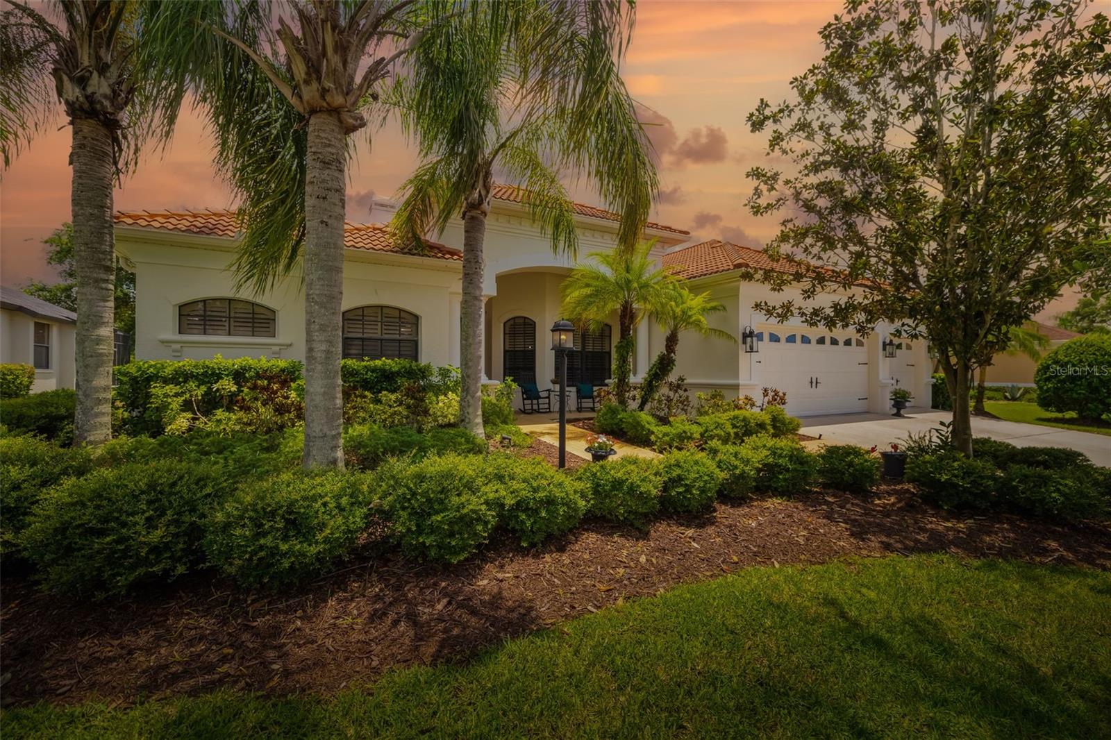 Blending character with that sought-after “feels like home” vibe, this 5-bedroom, 4-bath residence offers generous living space and undeniable warmth. Perfectly positioned on a quarter-acre in Greenbrook Village’s popular Vistas enclave, you’re only a short stroll to Adventure Park as well as other community parks, nature trails, and scenic views. Your arrival into the home is met with a welcoming entryway that flows effortlessly into the living room, highlighted by tranquil views and a modernized fireplace. Enhancing the warm flow of the first floor of this 3,818 sqft home is the generous kitchen, adorned with granite countertops, a convenient breakfast bar, and a gas range. The first floor is finished with stylish LVP flooring (2020), offering a modern and cohesive look. Your Florida dream unfolds out back, where two shaded living areas provide endless ways to relax or entertain. Take a dip in the pool, melt into the spa, and let the scenic pond views remind you why you’re here. The upper level offers a generous bonus room adaptable to your needs, two inviting guest bedrooms, and a full bath. Completing the space is a covered upstairs patio ideal for quiet mornings or evening relaxation. Rounding out the features are impressive storage and closet space, a roomy 3-car garage, and the advantage of low HOA dues. Other updates in the home include: Both interior and exterior paint, shiplap fireplace wall, plantation shutters, new pool heater and salt cell, new washer/dryer, new refrigerator, and updated light fixtures. Enjoy an unbeatable address in the heart of Lakewood Ranch, an 8-time award-winning master-planned community. Here, top-rated schools are around the corner, and the UTC district, Main Street, golf courses, parks, and world-famous beaches are all within easy reach.