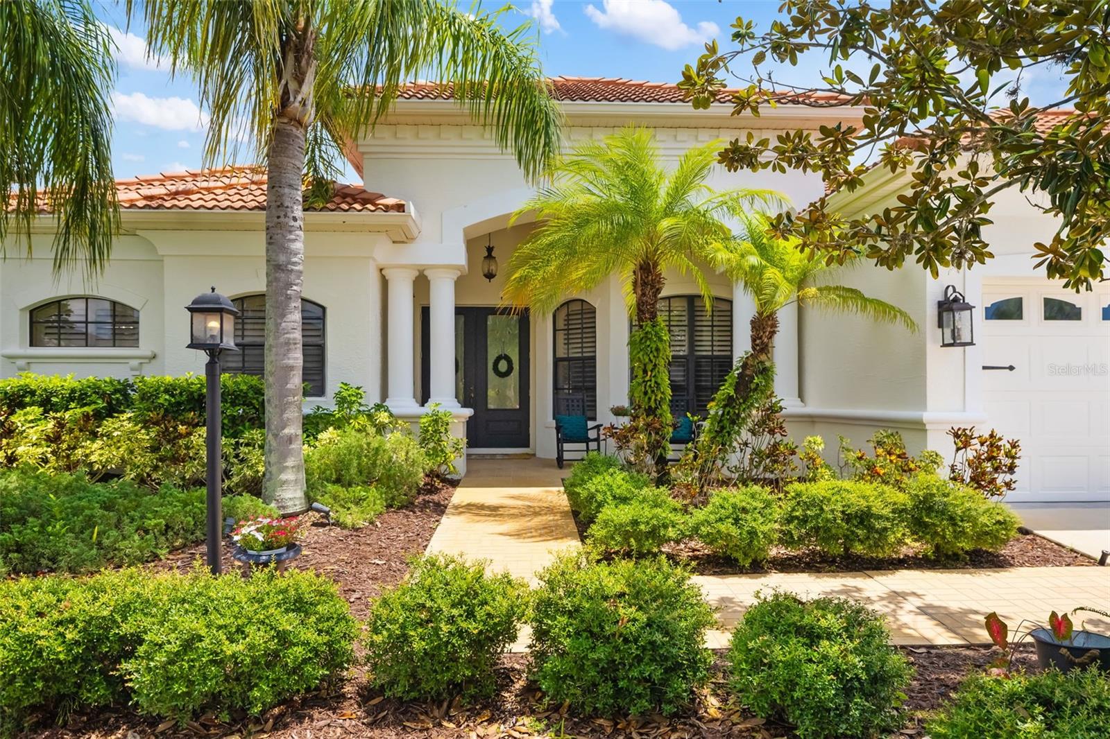 Blending character with that sought-after “feels like home” vibe, this 5-bedroom, 4-bath residence offers generous living space and undeniable warmth. Perfectly positioned on a quarter-acre in Greenbrook Village’s popular Vistas enclave, you’re only a short stroll to Adventure Park as well as other community parks, nature trails, and scenic views. Your arrival into the home is met with a welcoming entryway that flows effortlessly into the living room, highlighted by tranquil views and a modernized fireplace. Enhancing the warm flow of the first floor of this 3,818 sqft home is the generous kitchen, adorned with granite countertops, a convenient breakfast bar, and a gas range. The first floor is finished with stylish LVP flooring (2020), offering a modern and cohesive look. Your Florida dream unfolds out back, where two shaded living areas provide endless ways to relax or entertain. Take a dip in the pool, melt into the spa, and let the scenic pond views remind you why you’re here. The upper level offers a generous bonus room adaptable to your needs, two inviting guest bedrooms, and a full bath. Completing the space is a covered upstairs patio ideal for quiet mornings or evening relaxation. Rounding out the features are impressive storage and closet space, a roomy 3-car garage, and the advantage of low HOA dues. Other updates in the home include: Both interior and exterior paint, shiplap fireplace wall, plantation shutters, new pool heater and salt cell, new washer/dryer, new refrigerator, and updated light fixtures. Enjoy an unbeatable address in the heart of Lakewood Ranch, an 8-time award-winning master-planned community. Here, top-rated schools are around the corner, and the UTC district, Main Street, golf courses, parks, and world-famous beaches are all within easy reach.