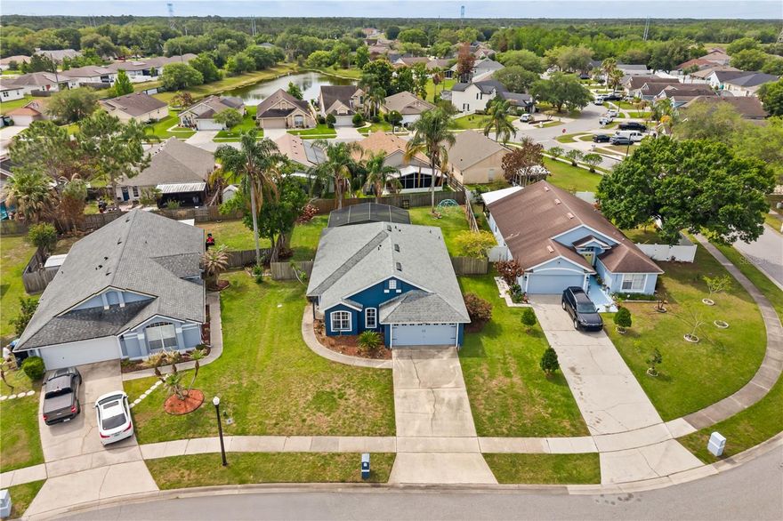 Beautifully maintained 3-bedroom, 2-bath single-story home featuring a private in-ground screened pool — your own backyard oasis for year-round Florida living! Roof replaced 5 years ago, A/C replaced 7 years ago. Step inside to an open, light-filled great room with soaring vaulted ceilings, arched transom window, and easy-care wood-look flooring throughout the main living areas.
The spacious kitchen offers stainless steel appliances, abundant cabinetry, a breakfast bar pass-through, and a sunny eat-in dining area with picture window. A separate formal dining room with chair-rail detail flows seamlessly to the screened lanai through sliding glass doors — ideal for entertaining or relaxing poolside.
The private primary suite is a true retreat, offering a vaulted ceiling, large walk-in closet, and direct access to the screened lanai. The ensuite bath features a garden soaking tub, separate walk-in shower, dual-sink vanity, and private water closet. Two generously sized secondary bedrooms share a full guest bath with tub/shower combo. A dedicated interior laundry room with included washer and dryer adds everyday convenience.
Additional highlights include a two-car garage, cathedral ceilings throughout, split-bedroom floor plan, and mature landscaping. Tucked in a quiet, established neighborhood with convenient access to shopping, dining, and major commuter routes.