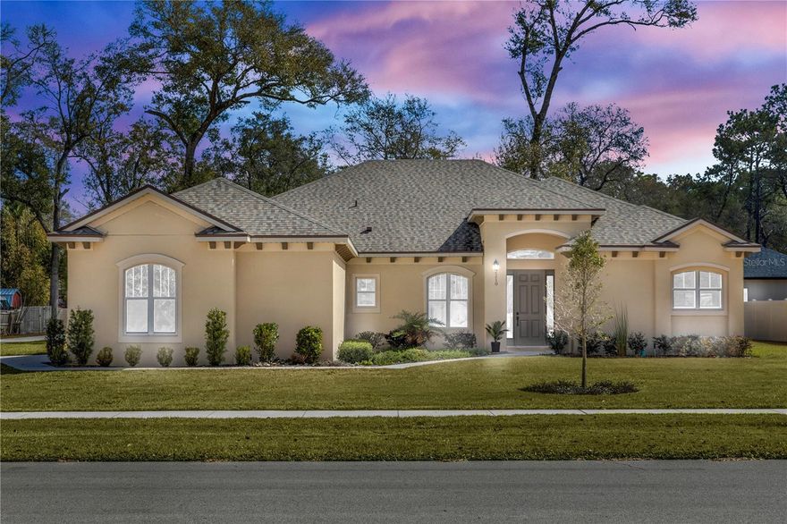 MOVE-IN READY NEW CONSTRUCTION in a fantastic location with NO HOA and an oversized lot (.40 acres)! This 3-Bedroom, 3.5-Bath home features an oversized 3-car side-entry garage and a popular split floor plan with five pocket doors to maximize living space. Soaring 10’–12’ ceilings create an open, airy feel throughout. The gourmet kitchen is designed to impress with a large island family bar, custom white shaker cabinetry with crown molding, walk-in pantry, spacious breakfast nook, upgraded appliances, under-cabinet lighting, solid granite countertops, and under-mounted sinks. Expansive windows fill the home with natural light and showcase beautiful views. Premium finishes include vinyl plank flooring throughput, upgraded plumbing and lighting fixtures, designer bath tile, thick glass shower enclosures, and elegant crown molding in coffered ceilings. Energy-efficient features such as Low-E windows, high-efficiency A/C, and R-38 ceiling insulation provide long-term comfort and savings. The luxurious primary suite offers two large walk-in closets, dual vanities, a compartmentalized water closet, a freestanding garden tub, and a walk-in shower with custom tile surround. This home is pool-planned with convenient outdoor access from Bath 2 and the primary bedroom. Enjoy the oversized lot with lush landscaping and an automatic irrigation system. Centrally located just minutes to I-4, shopping, medical centers, and the library. Less than an hour to Daytona beaches, Orlando attractions, and three international airports. Only 10 minutes to the St. Johns River for boating and fishing, plus nearby Highbanks Marina and Blue Spring State Park for dining, camping, and manatee watching. Builder warranty included. Home may be under audio and visual surveillance.