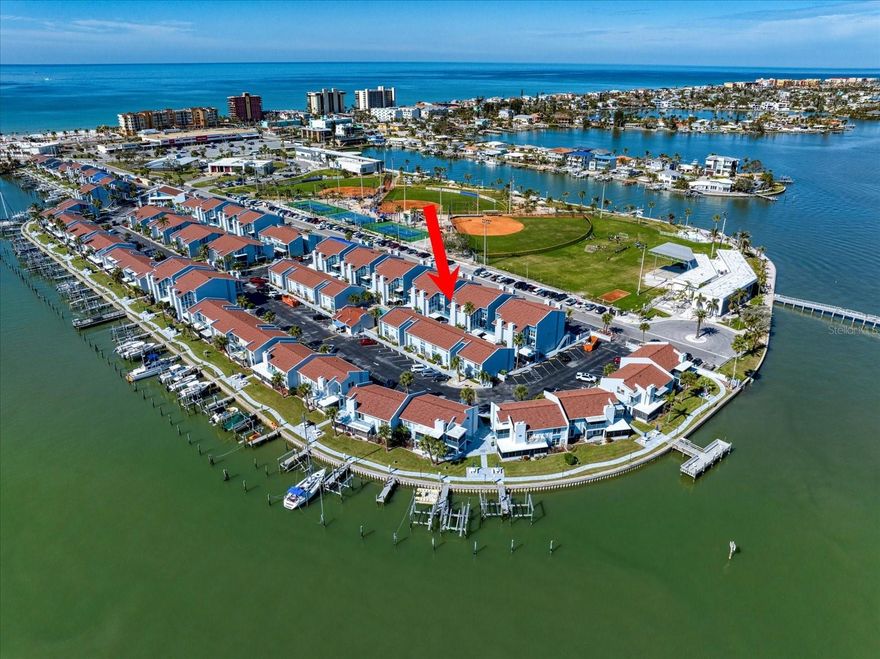 Looking for a GREAT INVESTMENT PROPERTY, SECOND HOME OR A MORE PERMANENT PLACE to hang your flip flops and live your best beach life? Look no further than 343 REX PL #G in Madeira Beach Yacht Club (MBYCC)…a perfect retreat from the hustle and bustle of everyday life for you and your guests. Up one flight of stairs, you will be welcomed to a HIGH AND DRY, MOVE-IN READY 2 STORY TOWNHOUSE STYLE unit with kitchen, living room, additional dining area and half bath on the first floor, and 2 bedrooms, full bath and laundry on the upper level. The unit is being OFFERED TURNKEY allowing you to move in, or rent out right away. 7 DAY RENTALS ARE ALLOWED giving you flexible occupancy options while maximizing additional income should you desire. MBYCC is a GATED COMMUNITY WITH RESORT STYLE AMENITIES that include waterfront walking paths and amazing intracoastal views (yes you will see dolphins), 2 heated swimming pools (one just steps from the condo door), hot tub, clubhouse, fitness rooms, fishing piers and more! And it doesn’t stop there…walk, ride or roll just a COUPLE OF BLOCKS TO THE BEACH where you and your guests can enjoy miles of sandy shores and breathtaking sunsets, every…single…night! ROC Park (across the street) offers waterfront activities, splash pad, playground, dog park, fishing pier, tennis, basketball, baseball and more! Local boutiques, coffee shops, bars, restaurants, library, post office, grocery and pharmacy stores are all within a short distance and world famous John’s Pass is a couple of miles away. PRO-ACTIVE BOARD with FULL-TIME ASSOCIATION MANAGEMENT ON-SITE. COMMUNITY MILESTONE INSPECTION PASSED and SIRS RESERVE STUDY COMPLETED. Full set of condo docs available upon request. Be sure to VIEW THE 3D TOUR link for an immediate walk through experience. Then schedule your in person visit and DON’T FORGET TO BRING YOUR FLIP FLOPS!