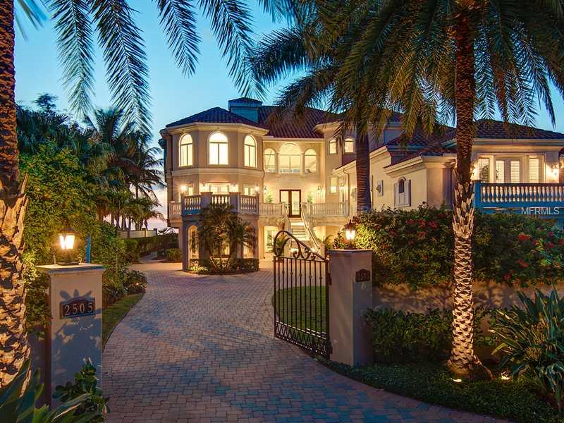 Beautifully located on 8-mile Casey Key, perhaps Sarasota's most exclusive barrier island,this gulf-to-bay residence is replete with elegant finishes and was built in 2003 on concrete-driven pilings. Upon entering the foyer, the sight lines draw you into the formal great room with an exquisite coffered ceiling, fireplace, and out to the large terrace, pool and "wow" views of the Gulf of Mexico and gulf-side pool. The amenities include five generous en-suite bedrooms; marble floors and counters in all baths; one is organized as an au pair suite with separate living area and separate entrance; four balconies facing the Gulf and one situated off the dining room over the porte cochere; there is an outdoor kitchen off the family room with ample seating area. The master suite feels as if you are entering a spa with its generous bath and exquisite marble columns flanking the Jacuzzi tub. The kitchen features Yoder custom cabinetry; "blue eyes" granite on the countertops and in the wrap-around butler's pantry; two laundry rooms; a generator; 4-vehicle garage, dock with lift; an elevator that even goes to the attic. Casey Key is an 8-mile island with fewer than 400 single family homes; with no traffic lights, and no high rise condominiums. Located within minutes of the historic walking town of Venice, with its own airport; The Oaks Country Club is just 10 minutes away, and you are 15 miles south of the cultural mecca of downtown Sarasota.