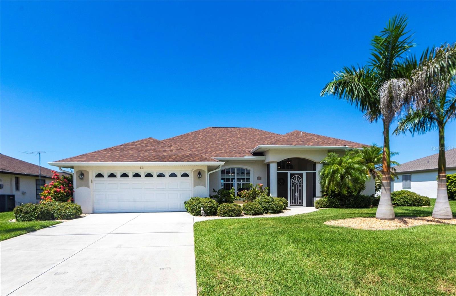 Welcome home to 53 Fairway Rd! Situated in the Rotonda West golfing community, this impeccably maintained and updated pool home with Southwest rear exposure enables maximum enjoyment of the Florida sun with views of the freshwater canal. Custom chef's kitchen features solid maple cabinetry, granite countertops, ceramic tile backsplash, and newer stainless appliances. Multiple seating areas around the kitchen island, the dinette, the formal dining, and the oversized lanai make for the perfect space to entertain family and friends. Split layout floorplan ensures the utmost privacy for owners and guests alike. Primary en suite offers a continuation of the custom maple cabinetry for ample storage, and a huge curb-less, walk-in shower provides a spa-like retreat in your own home! All 3 bedrooms boast walk-in closets for extra storage space, as does the dedicated laundry room with cabinets, shelving, and a broom closet. Your guests will be impressed with the private entry into the back guestroom from the extended lanai, as well as the pool bathroom for convenience. For the new owners' peace of mind you will find most major components are new within the past few years: New Roof 2025, New Soffit 2025, New Pebble Tec Pool Resurfacing 2025, New Pool Skimmer 2025, HVAC 2021.