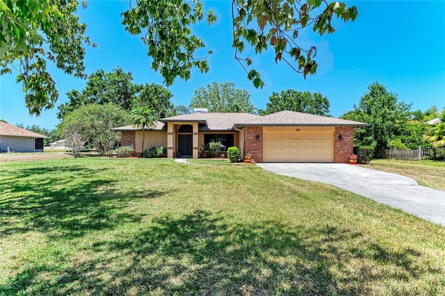 Located in the highly sought-after Mill Creek community, this well-maintained home is being offered for the very first time by its original owners. Solidly built and thoughtfully designed, it sits on a premium homesite of over one acre, featuring peaceful lake views and generous outdoor space to enjoy Florida living. Upon entering through the double doors, you’re welcomed into a spacious living area highlighted by vaulted ceilings, a striking fireplace, and two sets of French doors that fill the room with natural light and showcase views of the screened pool, expansive backyard, and lake beyond. The formal dining room, complete with IMPACT windows, provides an inviting setting for gatherings and special occasions. The home offers a functional, comfortable layout with excellent potential for personalization or updates. The kitchen features generous cabinet storage and a bright breakfast nook ideal for casual dining. A split floor plan enhances privacy, with the primary suite tucked away and offering dual closets, an en-suite bath, and direct access to the southeast-facing patio—perfect for morning coffee or relaxing evenings outdoors. Two guest bedrooms and a full bath, also serving as the pool bath, are located on the opposite side of the home. Outdoors, an expansive covered terrace spans much of the home and overlooks an electric heated pool and spa, creating an ideal space for year-round enjoyment. Additional features include a long extended driveway for added parking, a new roof (2024), and IMPACT windows (2019), offering peace of mind for years to come. Mill Creek is known for its estate-sized lots, low HOA fees, and no CDD fees, all while being conveniently located near top-rated schools, shopping, dining, and major roadways. Just minutes from Lakewood Ranch and a short drive to Florida’s renowned Gulf beaches, this home offers an exceptional combination of location, space, and opportunity.