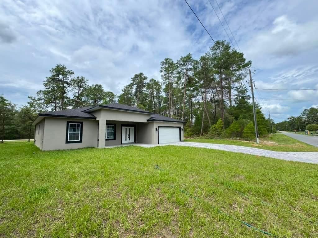 Photo of 1458 W Landmark Drive, Citrus Springs, FL 34434 (MLS # O6424187)