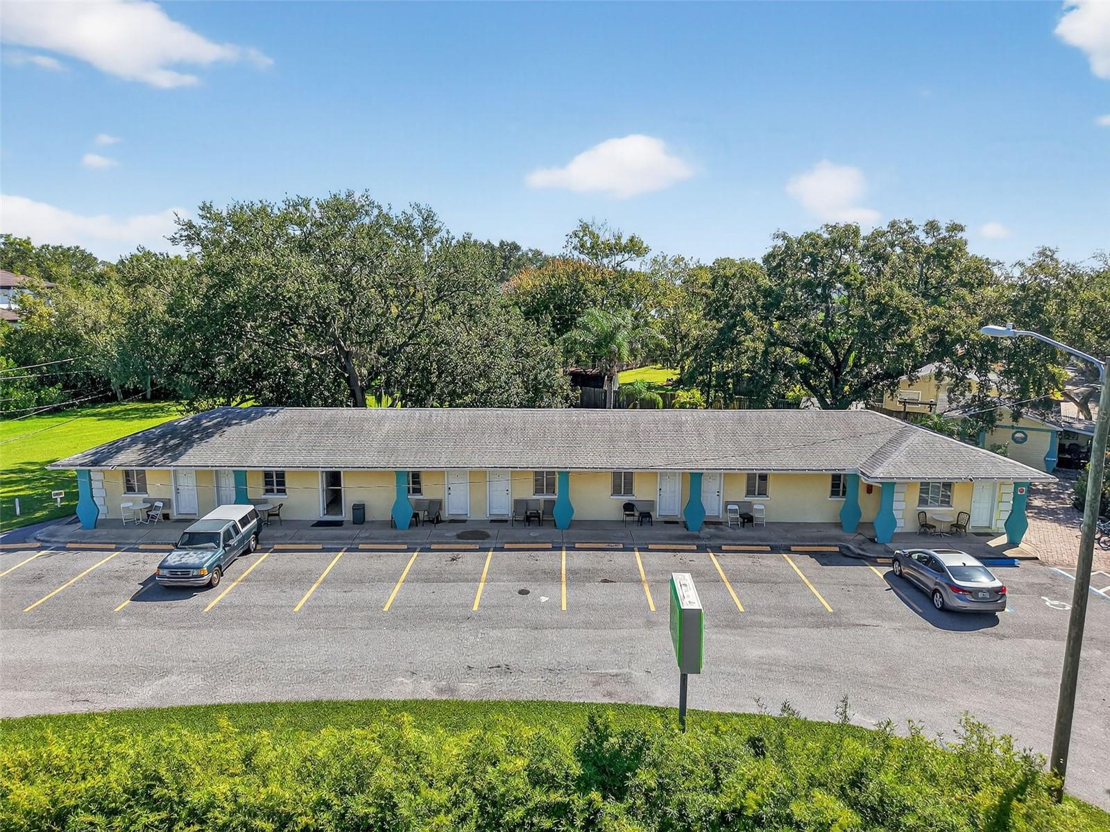 Welcome to the Marbay Motel, a well-established property with unique character and tremendous potential in Safety Harbor. This 8-unit motel plus office with attached bedroom and 9 bathrooms sits on a spacious 1.54-acre lot in a prime location. Currently generating an average of $20K in monthly revenue, this property is both a proven income producer and a rare redevelopment opportunity. The 8 remodeled units each feature kitchenettes, with SMART systems including locks and TVs for modern convenience. The office with an attached bedroom adds flexibility for on-site management. Recent upgrades include 4 new A/C units (2024 & 2025), a repaved parking lot, and other ongoing improvements. Guests enjoy on-site amenities such as mini golf, on-site laundry, a covered pergola with BBQ. The property has even made appearances in two films and a recent Publix commercial, adding to its local charm and recognition. With its prime Safety Harbor location, this property is ideal for hosting events or exploring future development. A request to negotiate with the city has already been approved to rezone for residential buildings, opening the door for 10–12 potential residential structures - a fantastic opportunity for the right developer to bring the vision to life. Just 5 minutes from downtown Safety Harbor’s restaurants, breweries, and shops, and close to Philippe Park with water sports rentals and a boat ramp, this property is also only 6 minutes to Chi Chi Rodriguez Golf Course and less than 30 minutes to Tampa, TIA, Raymond James Stadium, and the Gulf beaches. Whether you’re looking for a profitable short-term rental/motel business or a prime redevelopment project, the Marbay Motel offers endless possibilities.