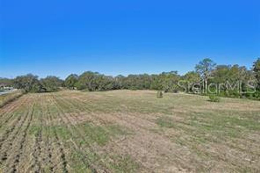 This 5 acre plot was recently rezoned from residential/religious use to BPC-2 zoning. This plot is appropriate for investment, development, or 1031 exchange. The purpose of the BPC-2 (business park center-2) district is to provide areas for light-industrial activities. The BPC-2 district permits light manufacturing, fabrication, assembly, distribution and wholesaling activities, and some retail uses to support the businesses and activities within the Business Park Center. Other potential uses may include: farm worker dormitory (barrack style), planned development, transitional area development, off-site agricultural support, airport, intensive animal farm, wild or exotic animal breed, boarding or rehabilitation; commercial vehicle parking, communication towers, community centers, isolated convenience stores, cultural facility, general farming, financial institution (including drive-through), gas station, golf course, government facility, heavy machinery sales and service, heliports, helistops, hotels and motels, kennels and breeders, lime stabilization facility, livestock auction and sale, light manufacturing, non-phosphate mining, motor freight terminal, retail nurseries and greenhouses, offices, office parks, non-certified low and high power plants, printing and publishing, passive recreation, religious institution, research and development, retail, restaurants, schools, universities, self-storage facility, production studio, solar electric power generation facility, transit, utilities, vehicle recovery, vehicle auto body and repair, veterinary service, warehousing/distribution, and waterski school. Come take a look at this versatile commercial land investment. Land is raw, water is connected. Picture represents land when it was mowed. Seller requests no seller finance, subject to (subto), wholesale, or assignable offers. Statements and measurements are believed accurate by Seller/Agent, however they cannot be guaranteed. Buyer and Buyer's agent must confirm all statements and measurements for themselves. Adjoining land at 4610 E County Rd 524 is also available for sale. Plots can be combined.