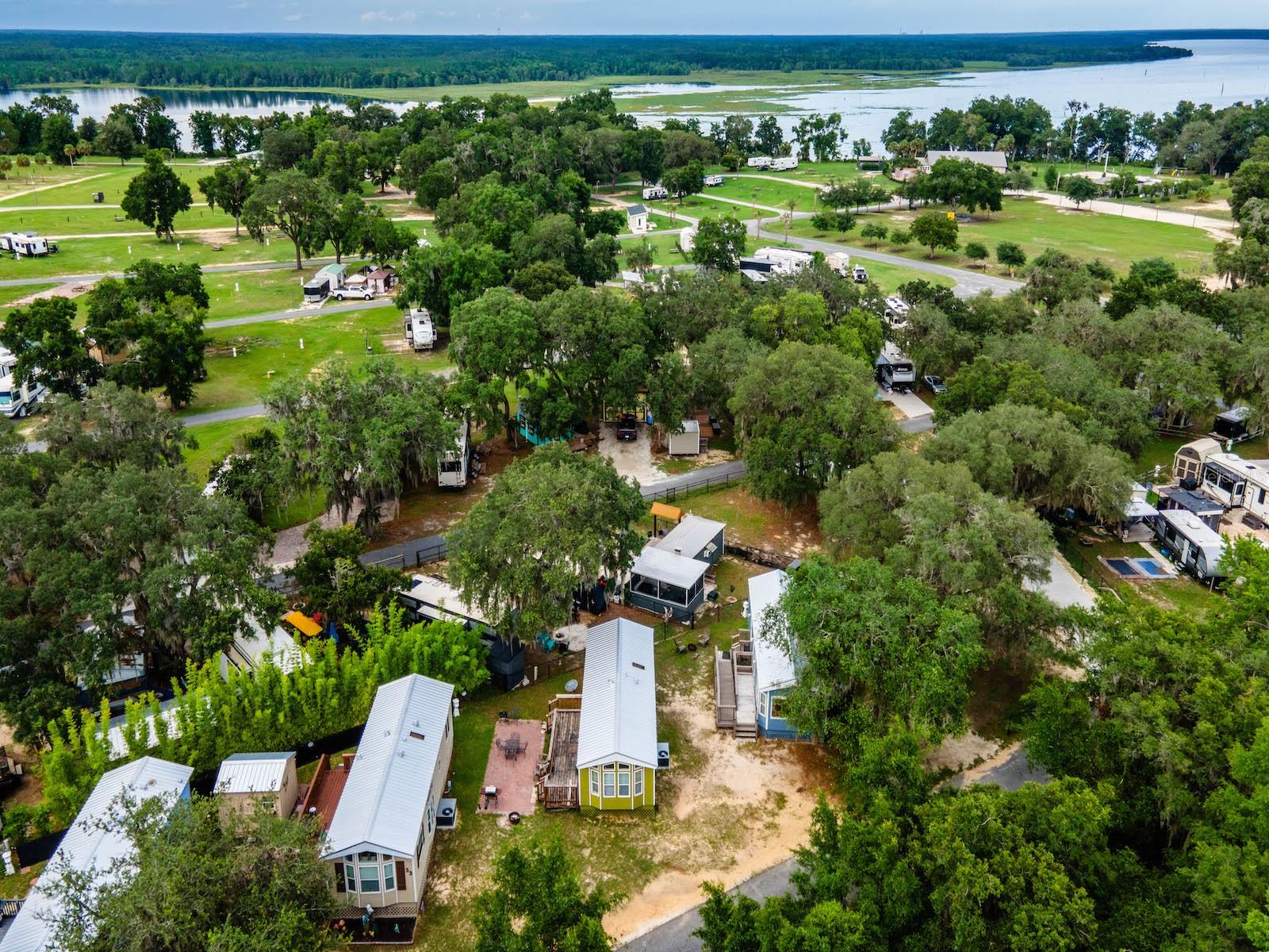 Charming Retreat Near the Ocala National Forest – 15991 NE 243 Place Rd Unit 31, Fort McCoy, FL 32134
Offered at $120,000 | 1 Bed | 1 Bath | 492 Sq Ft
Discover peaceful, low-maintenance living in this inviting 2006 mobile home located in the scenic KOA Oklawaha Campground. Whether you're looking for a full-time residence, seasonal getaway, or a short-term rental investment, Unit 31 offers comfort, value, and access to endless outdoor recreation.
This 492 sq ft home features 1 bedroom, 1 three-fixture bathroom, an open-concept living area, built-in kitchen, and a spacious wood deck perfect for outdoor relaxation.
Recent Upgrades & Maintenance (High-Value Improvements):
- New roof, floors and siding (2024)
- HVAC system repaired (2024)
- Shower leak professionally repaired (March 2025)
- Additional ground strapping installed (per county code prior to current ownership), adding extra stability and safety
Community Amenities:
Enjoy resort-style amenities in the KOA campground including:
- Swimming pool, clubhouse, and dog park
- Playground, volleyball, corn hole, and beach area
- ATV riding trails and scenic nature paths leading to a lake overlook
Family-friendly atmosphere with activities for all ages
Prime Location:
- Minutes from downtown Fort McCoy: grocery store, doctor, pharmacy, gas, hardware, and pizza delivery
- 30 miles to Ocala for additional shopping, dining, and medical care
Near lakes, springs, and Ocala National Forest for fishing, hunting, hiking, boating, kayaking, and ATVing
?? HOA includes electric, water, sewer, trash, and full access to amenities.
Whether you're looking to relax, explore, or invest, Unit 31 is a rare opportunity to own an updated, move-in-ready home in one of Central Florida’s most active outdoor communities.
Schedule your private showing today!