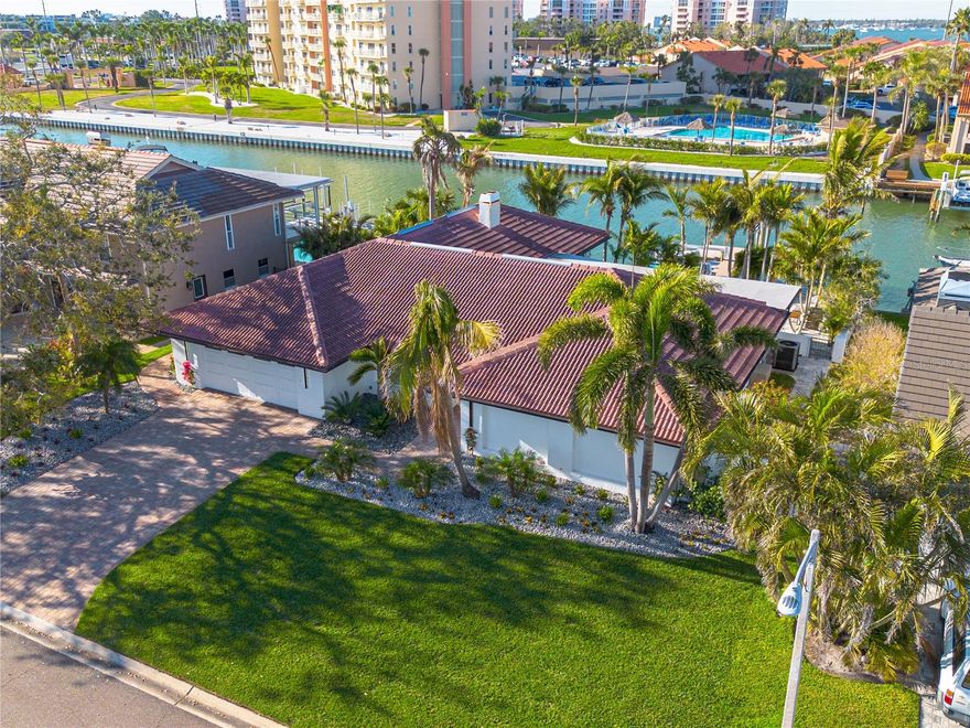 Tropical Waterfront Retreat in Bayway Isles – High & Dry with Direct Gulf Access

Welcome to elevated coastal living in the exclusive, gated enclave of Bayway Isles in St. Petersburg, Florida. This beautifully reimagined four-bedroom, three-bath residence with a flexible den/studio blends refined design, exceptional craftsmanship, and effortless waterfront living.

Perfectly positioned on a deep-water channel with direct access to the Gulf, this property is a boater’s dream. Enjoy 87 feet of waterfront frontage, a new seawall, private dock, a 16,000 lb boat lift, and an additional platform lift ideal for jet skis or kayaks. Adding to its appeal and peace of mind, the home remained high and dry during recent hurricanes, with no flooding, water intrusion, or wind damage.

Inside, a thoughtfully designed split floor plan offers both privacy and functionality. The luxurious owner’s suite is tucked away on one side of the home, while a spacious ensuite guest retreat and two additional bedrooms occupy the opposite wing—ideal for hosting family and friends. The den/studio provides versatility as a home office, creative space, or quiet retreat.

Every detail has been meticulously updated with high-end finishes and superior workmanship throughout. The chef’s kitchen is a standout, featuring premium appliances, custom cabinetry, and elegant finishes. Spa-inspired bathrooms, designer doors, custom trim work, and refined flooring elevate the home’s sophisticated aesthetic, while fresh, modern interiors enhance the light-filled, open-concept layout.

Step outside to your private tropical oasis. An expansive lanai overlooks a resort-style heated saltwater pool with a PebbleTec finish, surrounded by lush landscaping and beautifully curated hardscaping—perfect for entertaining or relaxing under the Florida sun.

Ideally located just minutes from Fort De Soto Park, St. Pete Beach, the iconic Don CeSar, and vibrant downtown St. Petersburg, this home offers convenient access to world-class dining, shopping, and recreation.

This is a rare opportunity to own a truly exceptional waterfront property in one of St. Petersburg’s most sought-after communities. Schedule your private showing today and experience the best of Florida living.