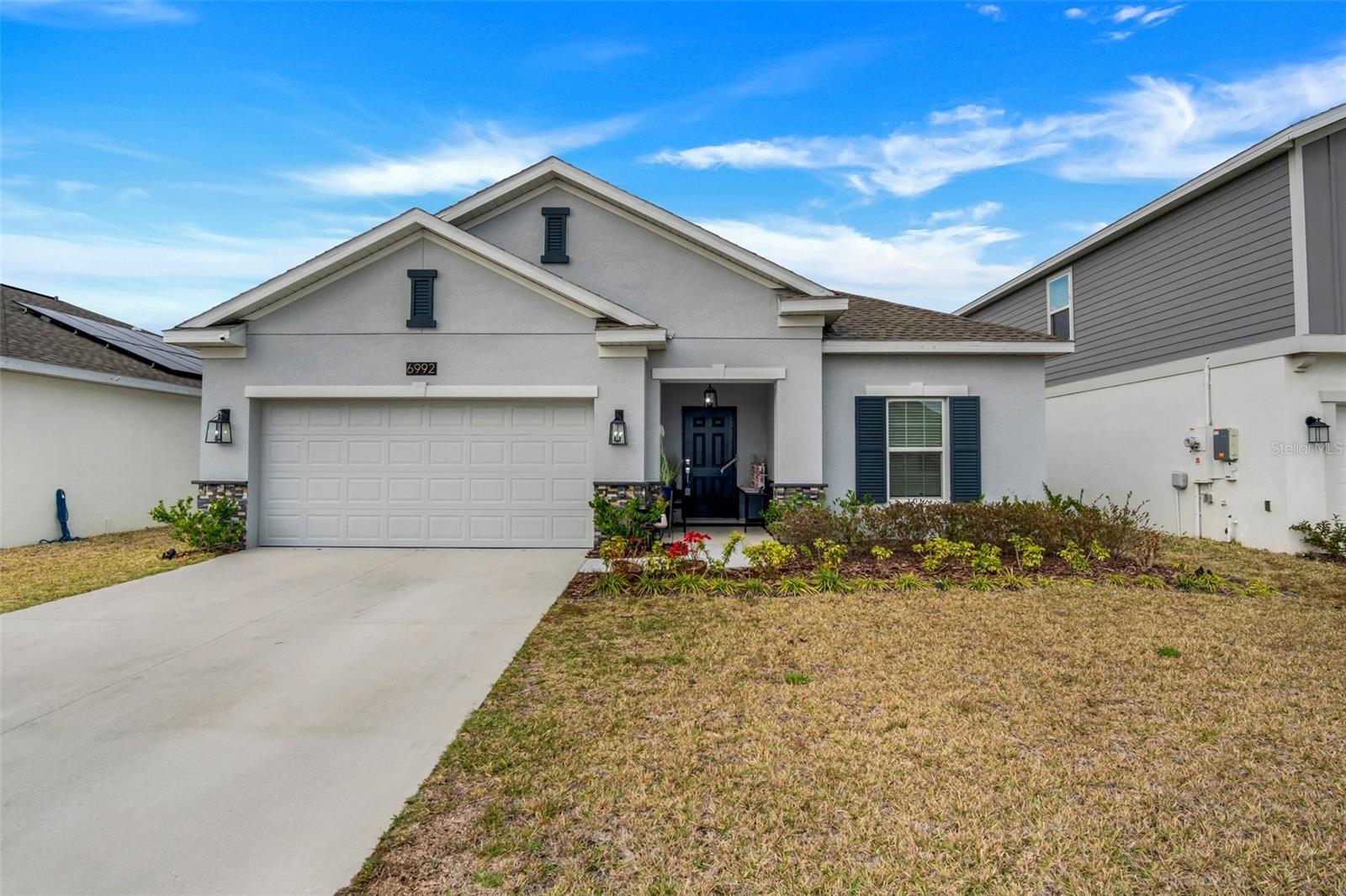Modern Elegance Meets Energy Efficiency in Trinity Lakes!
Welcome to this impressive 4-bedroom, 2-bathroom home in the highly sought-after Trinity Lakes community! Designed with modern living in mind, this recently built gem boasts soaring ceilings, a bright open-concept floor plan, and eco-friendly solar panels that keep your energy bills low without sacrificing comfort or style.
The heart of the home is a chef’s dream—featuring rich espresso cabinetry, luxurious quartz countertops, and a spacious layout perfect for entertaining or everyday living. The kitchen flows effortlessly into the main living area, where sleek tile flooring enhances the space with both beauty and durability.
Step outside to your own private, fenced-in backyard—ideal for relaxing, entertaining, or letting pets and little ones play safely.
Enjoy a host of resort-style community amenities, including a sparkling pool, splash pad, playground, clubhouse, and a fully equipped fitness center—offering the ultimate lifestyle experience for residents of all ages.
Don’t miss your chance to own a home that truly has it all—modern design, energy savings, privacy, and unbeatable community features. Schedule your private showing today and fall in love with everything Trinity Lakes has to offer!