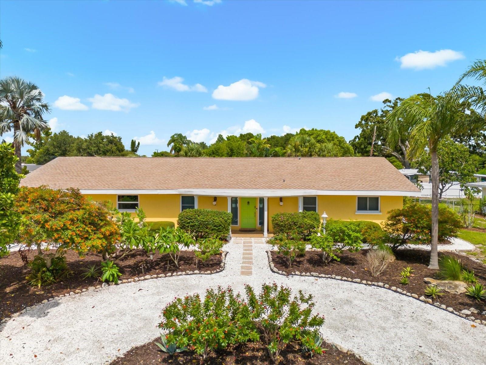 One-of-a-kind mid-century modern pool home on an expansive, oversized lot with lush tropical landscaping and a fully fenced-in backyard, located in Sarasota’s sought-after South Gate neighborhood. Known for its charm, character, and unbeatable location close to downtown, the beaches, Southside Village, and shopping, South Gate continues to be one of Sarasota’s most beloved communities. Originally the model home, it still showcases signature mid-century details such as curved walls, a sunken living room, terrazzo and Brazilian cherry floors, vintage light fixtures, and built-ins throughout. The home lives as a spacious two-bedroom, two-bath residence with an open floor plan, expanded family room, custom-designed kitchen with stainless appliances and breakfast nook, large walk-in closets, and updated bathrooms. A separate third bedroom suite is located just off the garage with its own private entrance, bathroom, and access to a peaceful back garden with deck and covered gazebo, making it ideal for guests, a home office, or in-law setup. The oversized saltwater pool has been resurfaced and is enclosed in a large screened lanai with plenty of space for entertaining. Additional features include a newer roof, hurricane-impact windows and sliders, solar panels for energy savings, updated electrical with buried power lines, and hurricane-rated garage doors. Located outside the flood zone and unaffected by recent storms. Both 4-Point and Wind Mitigation inspections have already been completed for added confidence. Residents may also join the South Gate Community Center for social events and neighborhood gatherings. Call today for a private showing of this truly special home.