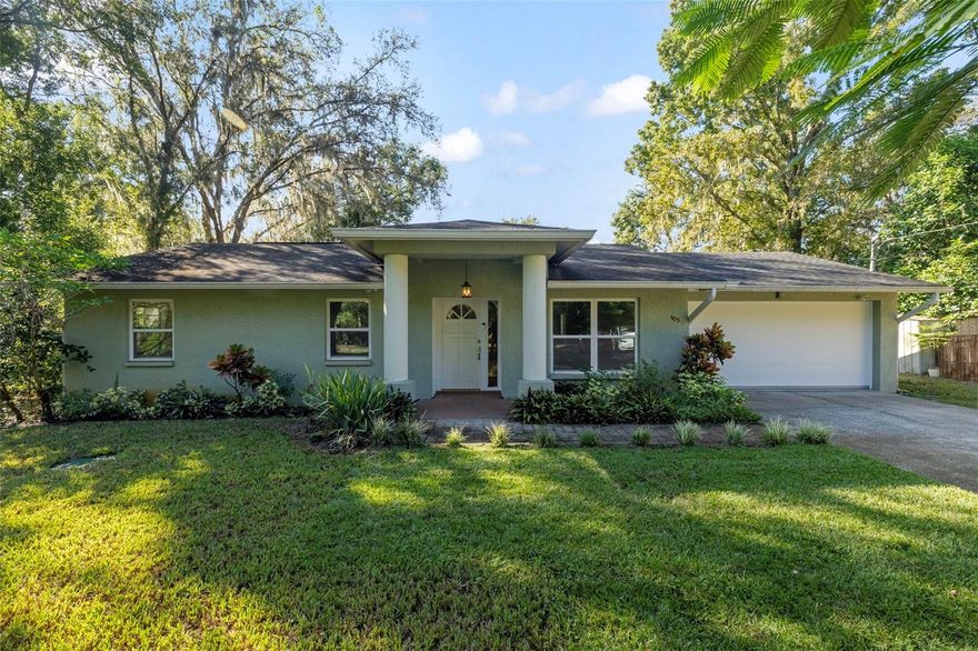 Discover a sense of calm and connection at this beautifully maintained 3-bedroom, 2-bath single-family home offering 2,120 sq ft of living space on nearly a third of an acre in the heart of Lutz, Florida. Tucked away on a quiet street with no HOA and no CDD, this home feels worlds away from the bustle — yet moments from every modern convenience. Step inside to an inviting open layout filled with natural light and no carpet throughout, blending comfort and functionality. The renovated kitchen features granite countertops, a stylish glass tile backsplash, stainless steel appliances, and dark wood cabinetry — creating a perfect balance of warmth and sophistication. The spacious primary suite offers a relaxing retreat with a custom walk-in closet and built-in storage, while updated systems — including a 10 yr old roof, new 2025 septic drain field, 2025 water heater, new water softener, generator hookup and most windows hurricane rated — deliver everyday peace of mind. Outside, your private backyard oasis awaits. Lounge under the vine-covered pergola beside a custom concrete-top fire table, or host gatherings on the expansive entertaining deck complete with covered bar area and ambient lighting. The lush, tropical landscape surrounds you with fruit-bearing plants like bananas, avocado, passion fruit, and monstera, creating a sense of calm that feels like your own private garden retreat. All this tranquility comes without compromise — just minutes from U.S. 41, I-275, shopping, dining, and top-rated schools, making it easy to enjoy both peaceful living and modern convenience.