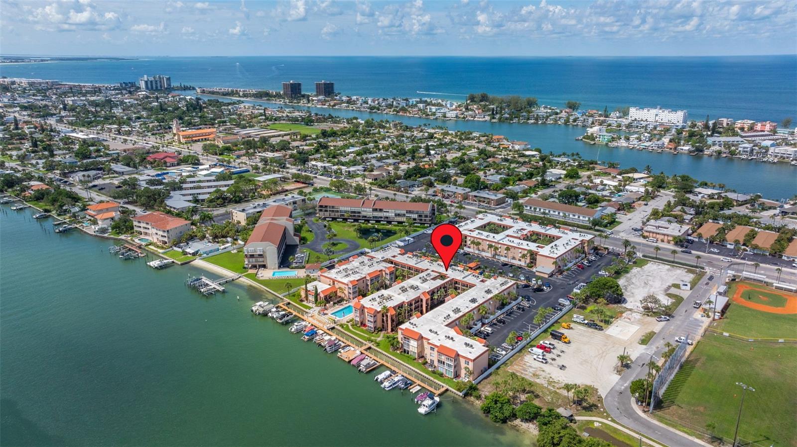 WATERFRONT COMMUNITY AT BOCA SHORES! This fully furnished 1-bedroom, 1-bathroom unit is located on the north side of St. Pete Beach. Available for ANNUAL RENTAL, this cozy unit features a spacious living area connected to the dining space. The kitchen, with its own designated area, maintains a partially open floor plan. The bedroom features a balcony that lets in plenty of natural light and includes a comfortable queen-size bed. The bathroom offers a convenient walk-in shower and a spacious vanity. With ample storage and space to entertain guests, this unit is perfect for your needs. Please NO SMOKING in the unit and NO PETS.