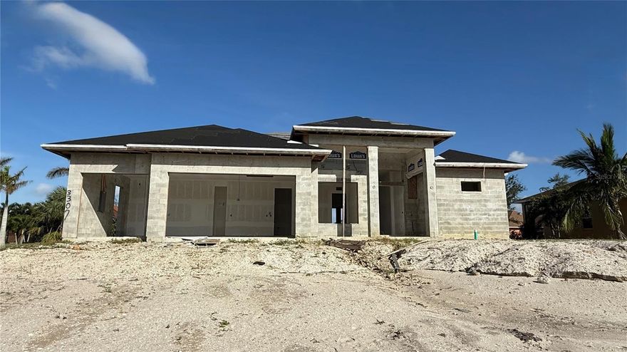 Under Construction. UNDER CONSTRUCTION / AS-IS opportunity on an oversized triple-lot homesite in NW Cape Coral (14,985 sq. ft., approx. 120’ x 125’). Planned as a 3-bedroom plus den, 3-bath home with 2,590 sq. ft. of living area (3,856 sq. ft. total) and a 3-car garage (per plans). This is the most advanced home in the portfolio, with major structural phases already completed: design/engineering, permits/fees, site preparation/fill, septic, slab, CMU block/beam, trusses, framing, and roofing. Interior work has begun, including partial drywall, insulation, and rough-in for plumbing, HVAC, and electrical (buyer to verify current field status). Remaining work to complete includes, but is not limited to: windows and exterior doors, stucco, interior trim/doors/hardware, cabinetry, flooring, paint, driveway, landscaping/irrigation, final punch/clean, inspections, and CO (buyer to verify). Buyer will be responsible for finishing construction and may select all finishes/specifications to their preference; finish level is buyer-controlled (from standard to high-end), subject to plans, budget, and buyer’s due diligence on neighborhood pricing and ARV. Sold as-is/where-is. No appliances, finishes, cabinetry, countertops, windows/doors, fixtures, or systems are represented as included unless independently verified by buyer. Buyer to verify current construction stage, plans/specs, permit status, inspections, and all completion requirements. Portfolio package available:See companion listings: MLS# C7520228 and MLS# C7520222.