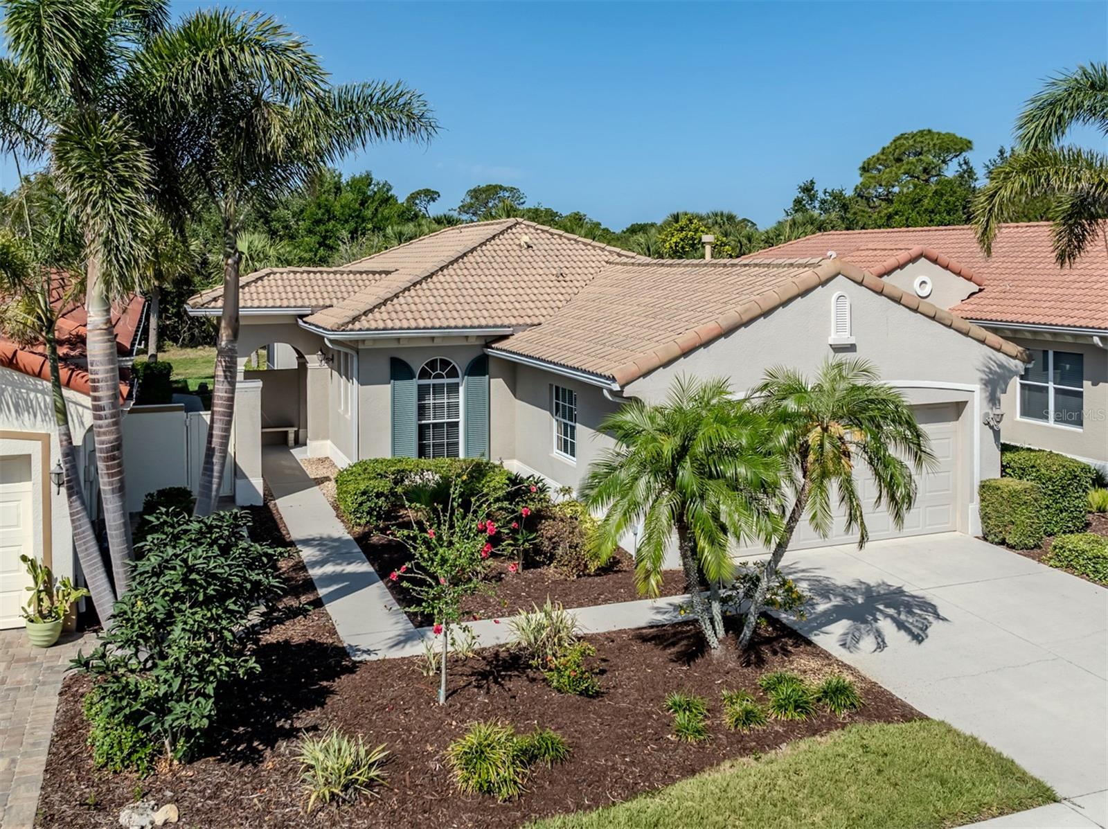 Welcome to this charming Giorgione WCI-built model, a two-bedroom, two-bath, maintenance-free home designed for comfort and relaxation. As you step inside, you'll find a move-in-ready open floor plan that is light and bright, recently painted to perfection. The living space boasts an extended screened lanai with picturesque preserve views and, off to the side, a tranquil water view to savor. The open kitchen make it a breeze to entertain create culinary delights. It feature lovely cabinetry, granite counters, a breakfast bar, and <B> Brand-New Stainless Steel appliances</B>, including a gas range, refrigerator, new kitchen faucets and dishwasher, all bathed in the inviting natural light streaming through the sliders that lead to the side garden area. The owner's suite is a true sanctuary, offering views of nature, two walk-in closets, and dual counters with sink plus a walk-in shower. For peace of mind, this home is equipped with hurricane impact windows. Additional features include new faucets in all baths, tray ceilings in the master and the great room, and many more upgrades. Situated in the Venetian Golf & River Club which is an exclusive paradise nestled in beautiful North Venice, just minutes from Gulf beaches and shopping. Enjoy exquisite dining with scenic vistas at The River Club, overlooking a serene 70-acre nature park along the Myakka River. Stay active and fit with our full fitness center and aerobics studio, take a refreshing dip in the lap pool, or indulge in the luxury of our resort-style pool and cabana bar. Tennis enthusiasts will be thrilled by the six-court Har-Tru tennis center just moments away. You also have pickleball courts. For the golf aficionados, our picturesque 18-hole championship course pays homage to legendary courses, offering an unparalleled golfing experience. Embrace a life of artful living, where every moment feels like a masterpiece.