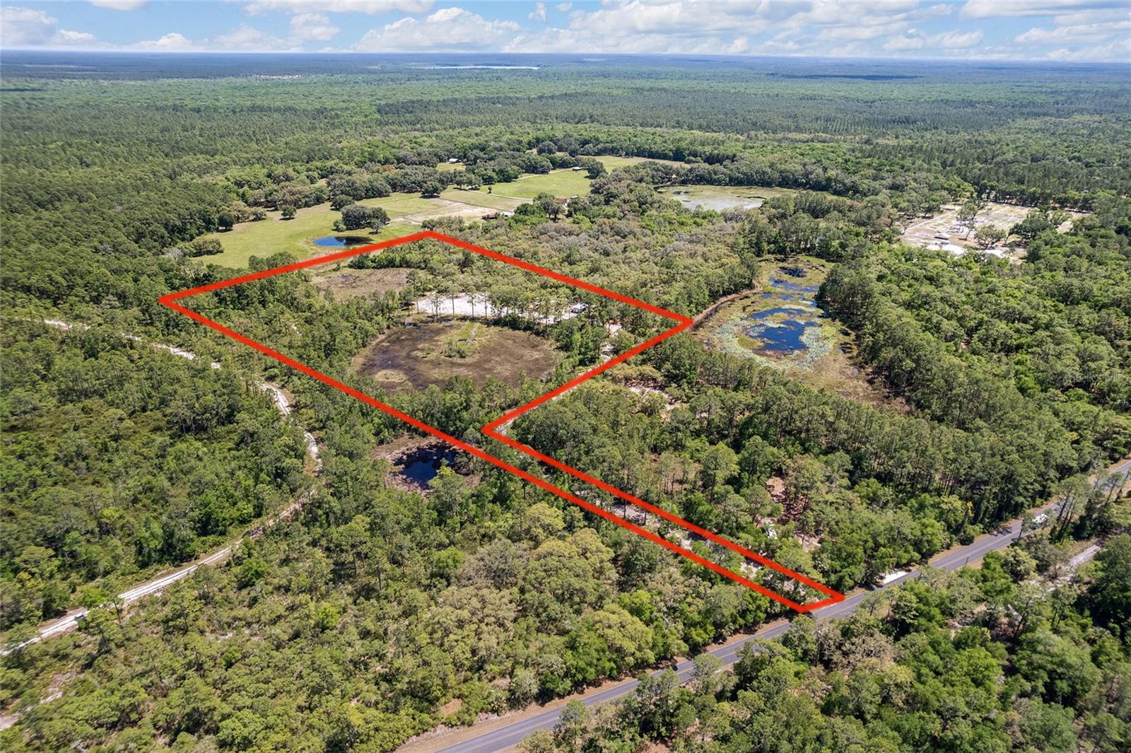 PRIVATE AND VERSATILE FLAG LOT WITH POND VIEWS AND NO HOA!
Tucked away down a long private driveway, this unique property offers peace, privacy and endless potential. Whether you're dreaming of a homestead, hobby farm, or retreat, this land delivers.
Approx.5 acres of ponds- Picturesque setting, attracts wildlife.
Cleared Homesite- Ideal spot for your dream home with beautiful pond views.
16x32 Shed- Great for Storage or work shop, metal roof
Borders the Ocala National Forest
This property is packed with character and ready for your vision. A rare find with tons of opportunity!!!