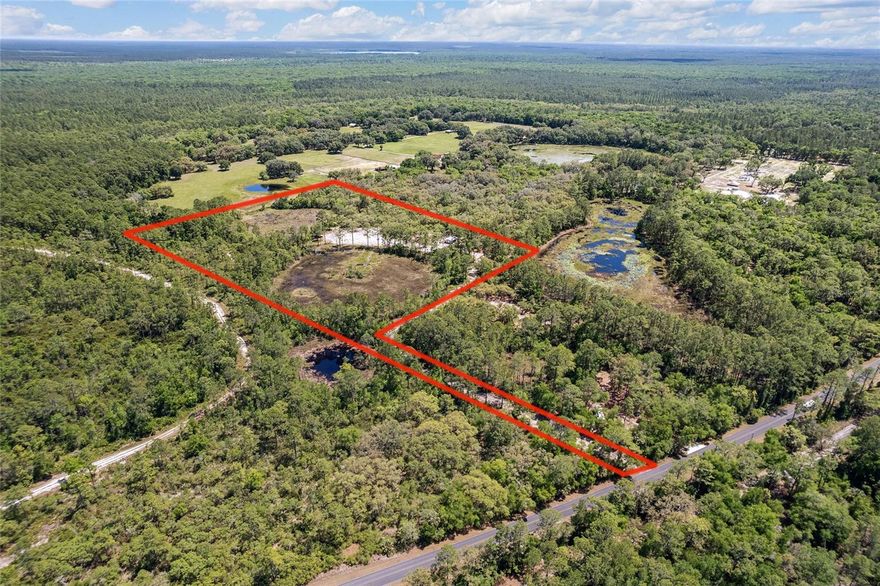 PRIVATE AND VERSATILE FLAG LOT WITH POND VIEWS AND NO HOA!
Tucked away down a long private driveway, this unique property offers peace, privacy and endless potential.   Whether you're dreaming of a homestead, hobby farm, or retreat, this land delivers.
Approx.5 acres of ponds- Picturesque setting, attracts wildlife.
Cleared Homesite- Ideal spot for your dream home with beautiful pond views.
16x32 Shed- Great for Storage or work shop, metal roof
Borders  the Ocala National Forest
This property is packed with character and ready for your vision. A rare find with tons of opportunity!!!
