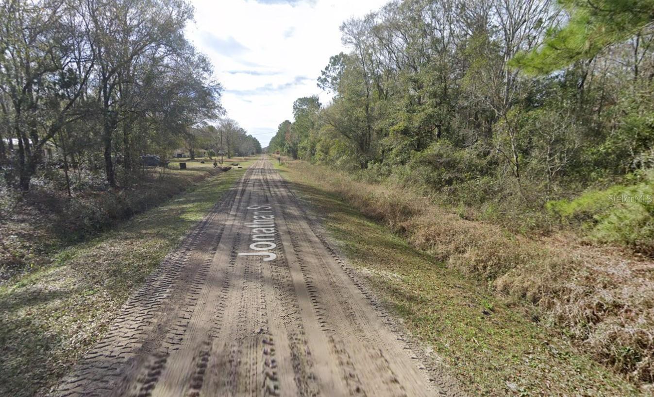 Welcome to 4590 Jonathan St., Hastings, Florida! This spacious 1.13-acre lot (165' x 300') faces south and offers a wonderful opportunity for country living. Located just 20 minutes from Palm Coast, this growing community is seeing new homes being built throughout the area. Enjoy the peace and quiet of rural life—bring your pets, raise chickens, and plant your favorite tropical fruit trees to create your ideal homestead. Drive by today and explore this fantastic opportunity!