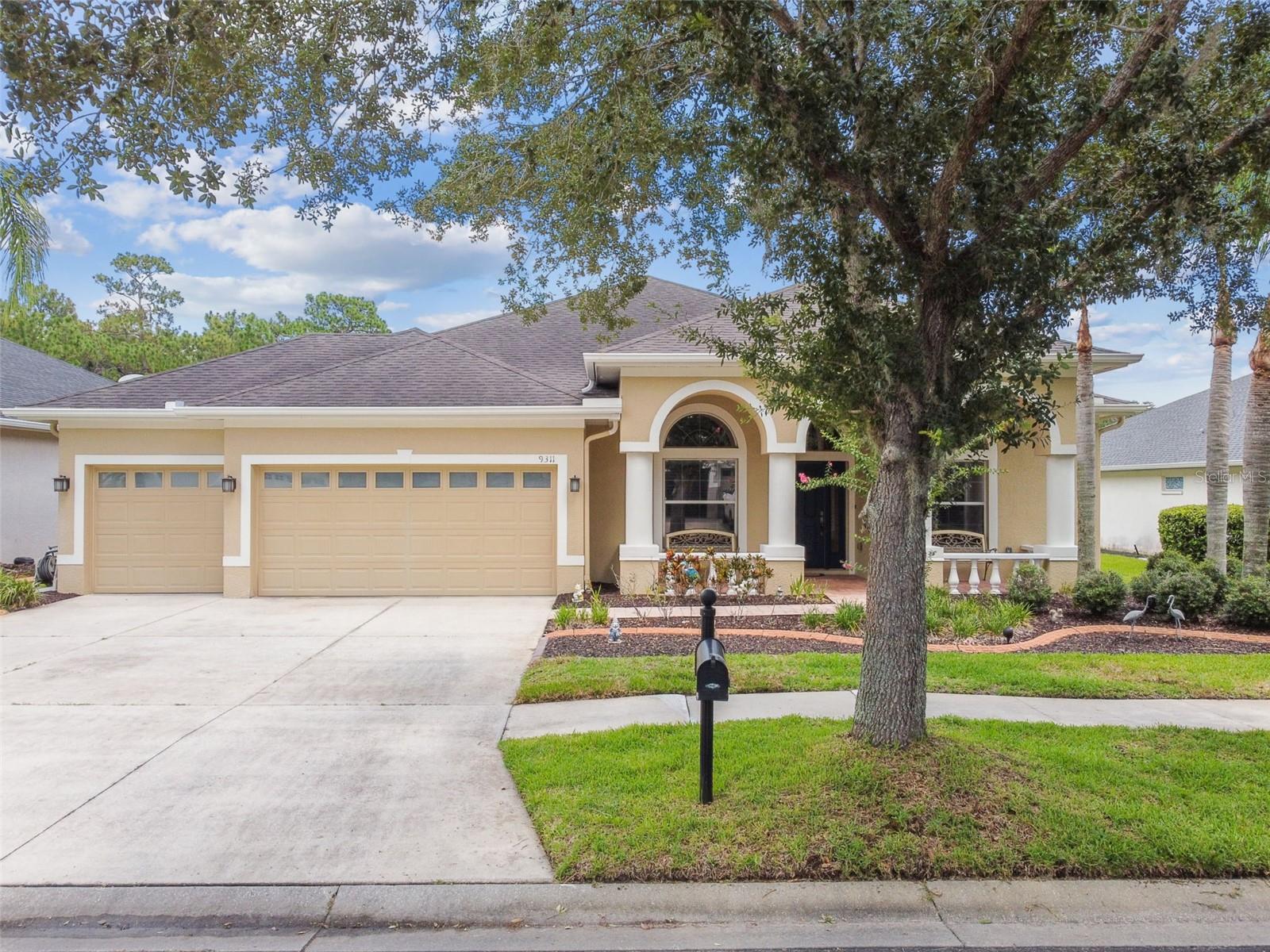This Stunning 4 Bedroom PLUS Office, 3 Bath, 3 Car Garage home with over 2,600 sf under air, features a huge covered and screened lanai, overlooking a private waterfront lot with conservation located on the far side... simply Tranquility! Located in Gated Live Oak Preserve in New Tampa.Â
The front elevation features a large cover front porch with plenty of room for benches on both sides of the covered entry. The oversized Kitchen features 42" cabinets, granite tops, LED under cabinet lighting, tile backsplash, and SS appliances, all overlooking the spacious Family Room with engineered wood floods, gas fireplace, and expansive sliders with view of the inviting Lanai overlooking the water and preserve area. With a Formal Dining Room, that features a tray ceiling and large windows, it is the ultimate place for entertaining.
Through double doors, the Owners Suite has Double tray ceiling, and 8' tall sliders and with ultimate views out back. The bath features dual sinks, walk in shower, and garden tub, with plenty of natural light.
The 3 remaining Bedrooms are on the opposite side of the home, along with 2 remaining Full Bathrooms and a laundry room with plenty of cabinets and shelving.
Additional features are the Office with Double Door Entry that could easily be converted to a 5th bedroom of needed, access directly to the 3 car garage from the Kitchen AND the Laundry Room. The covered lanai is plumbed for natural gas and the grill will stay. Additional energy efficiencies include a Radiant Barrier Roof, and all windows treated with 3M tinted/safety film, in addition tons of ceiling storage shelving in garage.
Live Oak features 3 access gates, 2 from Bruce B Downs, and 1 out the back to Kinnan St. The multi million dollar Clubhouse features a HUGE Resort style pool with access bridge across, Fitness Center, Billiards, Tennis and Pickelball Courts, Golf Driving Nets and Putting Greens, and more.
This home has been WELL taken care of by the original owner.