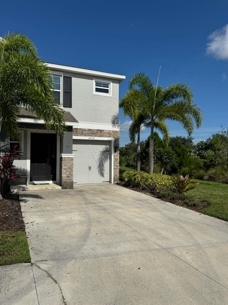 For lease in the heart of Palmer Ranch: this elegant 3-bedroom, 2.5-bath townhome offers comfort, style, and privacy. Built in 2019, it features a modern kitchen with stone countertops, stainless-steel appliances, and upgraded cabinetry, as well as an open living and dining area and an attached 1-car garage. All bedrooms are located upstairs, with a spacious master suite that includes a walk-in closet, double vanity, and walk-in shower. The property sits at the end of the street, providing extra privacy, additional parking, and a serene lake view. The gated community offers resort-style amenities including a large pool, covered lounge area, outdoor fireplace, and direct access to the Legacy Trail. Conveniently located just 10–12 minutes from Siesta Key Beach and Village, and only 10 minutes from Gulf Gate dining and downtown Sarasota entertainment. No smoking permitted; landlord may allow one small dog with fees. Rent is $2,650 monthly with a 12-month minimum lease.