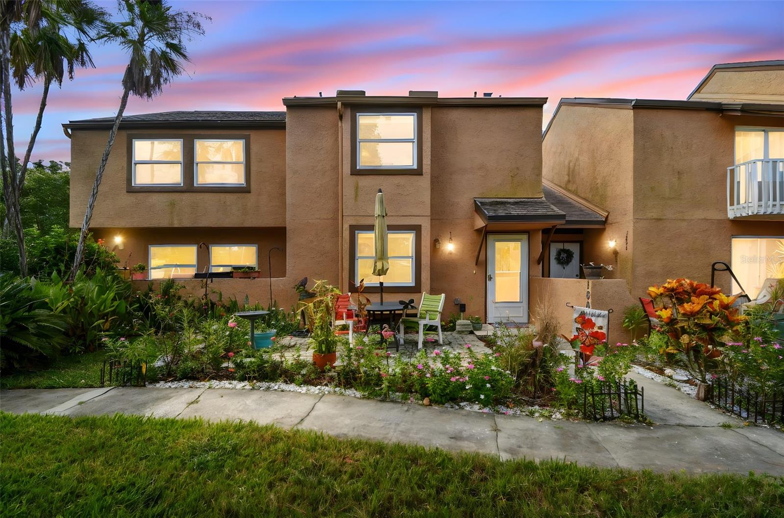 Location, Location, Location!!! Your carefree, maintenance free lifestyle awaits in fabulous Clearwater! Pride of ownership abounds in this immaculate, move-in ready, two-story condominium! Spacious 2 bedroom, 1.5 bath with one covered carport space… just under 1,000 sq. ft. of pampered living. First floor boasts a spectacular kitchen with eat-in area featuring tile flooring, granite countertop, tile backsplash, dual undermount sinks, upgraded hardware, under cabinet accent lighting, café style ceran top induction & convection range (2022), built-in microwave, dishwasher, side by side refrigerator and reverse osmosis water filtration system (2024). Bonus… coffee bar with granite countertop and additional cabinetry storage. Convenient half bath powder room with a lovely designer vanity, light fixture and cabinet all remodeled 7/2025. Open great room concept with living and dining room combination located just off the kitchen. Extend your living space through the French doors leading to an outdoor enclosed bonus area offering tile flooring, perfectly situated laundry room closet and the sellers are generously offering the washer and dryer convey with the home. Check out the massive storage room. The second floor features both bedrooms boasting carpet flooring and ceiling fans. One bedroom features a full wall closet while the second bedroom offers a full walk-in closet. Recently painted Jack and Jill bathroom offers luxury vinyl flooring, single decorative vanity, storage cabinet, toilet (7/2025), tub/shower combination featuring listello accents. Other notable upgrades include Water Heater (2023), Impact windows, Roof (2019). This lovely home is just steps from the refreshing community pool. Condo fee includes cable TV, Internet, exterior building and roof maintenance, grounds maintenance, sewer, water, trash and pest control services. Carefree Florida living at its finest! Pet friendly community offering a fenced dog park and plenty of guest parking…This community is centrally located providing easy access to shopping, schools, Gulf beaches and TIA…Live your dream!