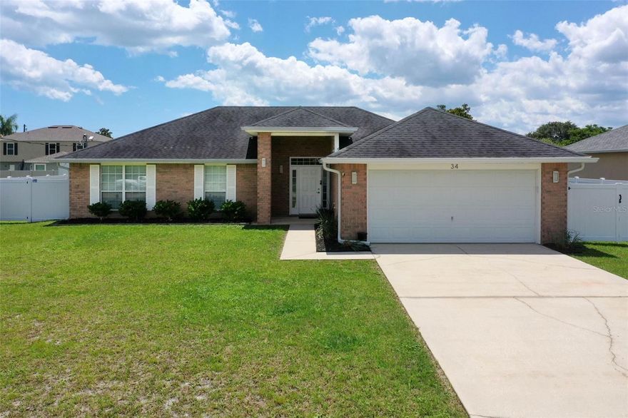 Beautifully maintained move-in-ready 4-bedroom, 2-bath home located in the desirable Palm Harbor area of Palm Coast, offering a peaceful residential setting. This spacious Adams Homes floor plan offers 1,804 living sq. ft. The 4th bedroom features French doors, making it a great option for a bedroom, home office, guest room, or flex space. Featuring vinyl flooring throughout, this home offers a bright, functional layout perfect for everyday living, working from home, or entertaining. The primary suite includes an ensuite bathroom with dual sinks, a relaxing garden tub, separate walk-in shower, and a California-style walk-in closet. Enjoy added peace of mind with major updates already completed, including a new roof in 2019, a new AC system in 2020 and gutters installed around the home in 2022. The backyard is fully enclosed with a brand-new 2025 6-foot white vinyl privacy fence, creating the perfect space for pets, outdoor gatherings, gardening, enjoying the sea breeze at night, or simply relaxing in your own private retreat. Conveniently located within walking distance to Matanzas High School and just minutes from I-95, shopping, dining, parks and beaches. This home also offers direct access to nearby trailheads with over 130 miles of connected multiuse trails and pathways. Enjoy the convenience of biking to nearby shops and restaurants while surrounded by natural beauty and wildlife right outside your door. This move-in ready Palm Coast home in Palm Harbor offers space, updates, location, and flexibility all in one. Don’t miss the opportunity to make it yours!