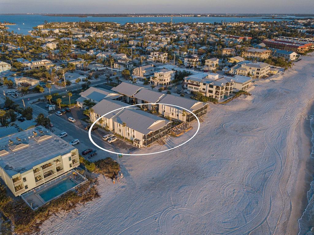 An Unparalleled Island Sanctuary! This is your rare chance to claim an extraordinary beachfront residence on the coveted Anna Maria Island, one of Florida's most exclusive and sought-after coastal enclaves. With sweeping, uninterrupted Gulf vistas and a highly coveted direct Gulf-front location, this refined condominium offers an unparalleled visual symphony of shimmering turquoise waters and awe-inspiring sunsets best enjoyed from your expansive, private covered balcony. Awaken each day to the soothing melody of gentle waves and savor the epitome of island elegance in this distinguished Holmes Beach haven. A grand double-door entrance welcomes you and your guests into a proper foyer, setting the tone for the light-filled, open-concept living space beyond. Designed with meticulous attention to showcase the breathtaking Gulf views, two oversized sliding glass doors blur the line between indoors and out, inviting the serene beauty of the beach directly into your home. The expansive open floor plan harmonizes the kitchen, dining area, and stylish living room, creating a seamless flow perfect for both relaxed everyday living and lavish entertaining. This 3-bedroom, 2-bathroom retreat includes thoughtful conveniences such as an interior laundry room, an owner's closet, and an additional storage room all situated on the desirable second floor. Step outside and immerse yourself in the intimate, boutique-style community, where a lush tropical courtyard leads to a beachfront pool and an exclusive sundeck, an idyllic oasis just steps from the renowned sugar sand beach. Additional amenities, including a private tennis court and designated off-street parking for both you and your guests. With effortless access to chic local boutiques, gourmet dining, and the island's charming free trolley, exploring the magic of Anna Maria Island has never been easier. Whether you desire a luxurious beachfront escape, an elegant year-round residence, or a high-end investment opportunity, this exceptional property offers a once-in-a-lifetime chance to own a true piece of paradise. Don’t let this extraordinary offering slip away schedule your private showing today and experience island luxury at its finest.