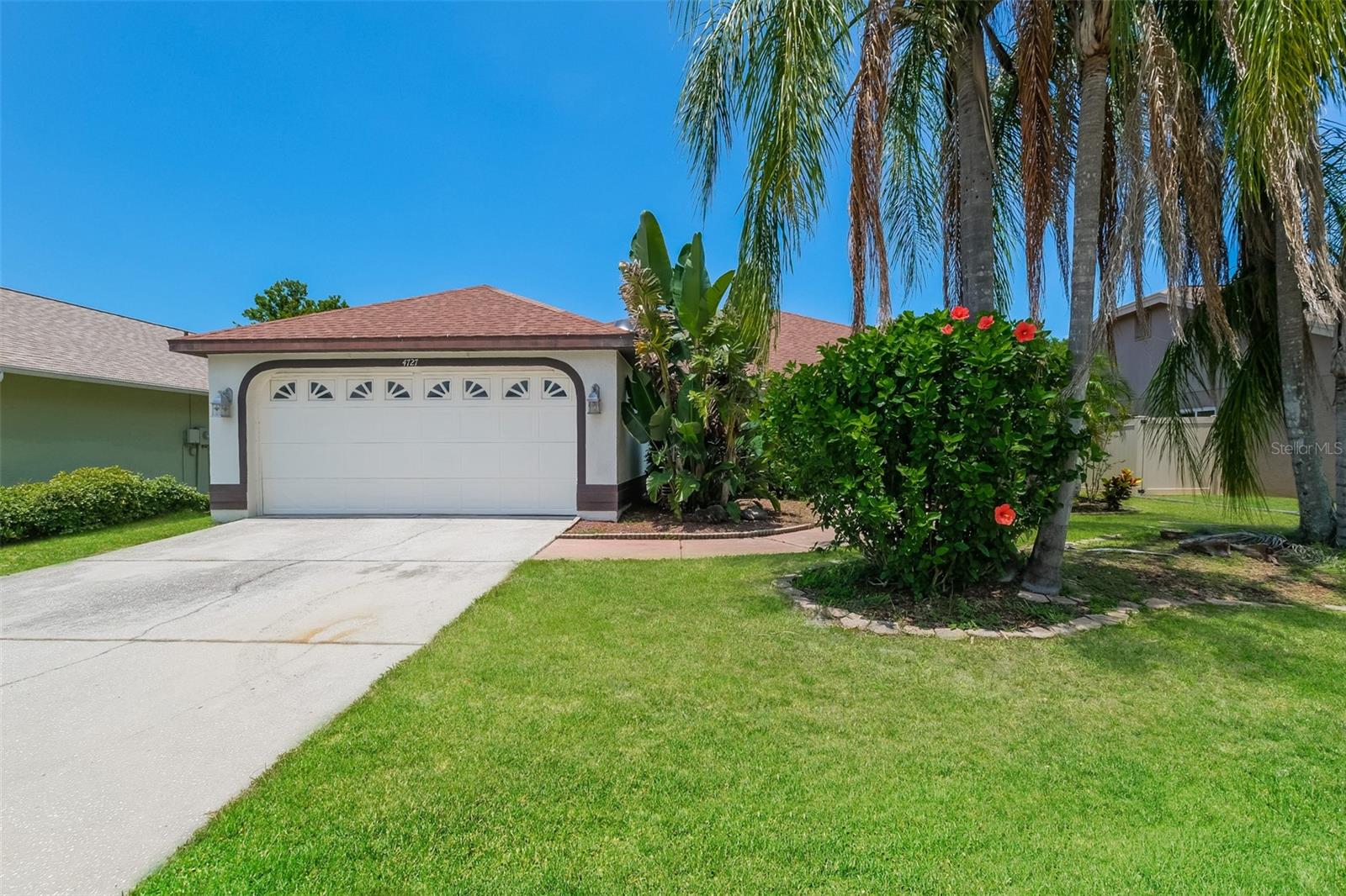 Charm and curb appeal abound for this New Port Richey home! Step inside the inviting foyer and into the well-appointed living room, positioned at the center of the home. The kitchen boasts stainless steel appliances, hard surface countertops, ample storage and a breakfast nook. This split ranch style floorplan offers the primary suite on one side of the home and three secondary bedrooms on the other. Enjoy the covered patio and private, enclosed backyard all year long! Come and see for yourself the possibilities that this home has to offer!