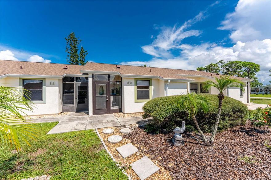 Welcome to your Florida paradise in this 55 plus, maintenance-free community. This turnkey furnished condominium boasts lots of upgrades including new roof installed in 2022, HVAC & insulation replaced in the last 3 years, a tankless hot water heater, whole house reverse osmosis system, new washer & dryer, updated kitchen and baths, $3,000 custom blackout blinds installed throughout, and an air-conditioned, enclosed lanai with new porcelain tile. The desirable open concept layout provides the perfect space for entertaining with a spacious living area featuring a 10' vaulted ceiling and sliding glass doors leading out to the air-conditioned lanai so you can easily expand your living space while staying cool. This space has ample windows equipped with custom blinds and a "buffet bar" with cabinets for storage or a place to serve your guests during dinner parties. Back inside, the updated kitchen has granite countertops, subway tile backsplash, ample wood cabinetry, an updated sink and faucet, with easy to maintain tile flooring. Conveniently located steps away from the dining area that will easily accommodate your close family and friends, and has updated laminate flooring that continues throughout the main living areas. The primary suite has a large bedroom with a built-in closet, an ensuite bath updated with granite and plenty of wood cabinetry, and the shower has tiled walls with an accent strip and dual shower heads. The guest bedroom features tile floors, a ceiling fan, roomy closet with the guest bath just steps away and offers a shower/tub combo, the same, matching tile floors, wood cabinets, granite countertop, and the added bonus of a linen closet. Lets not forget the laundry room that has additional storage space, plus a storage closet in the entry (great for your cleaning supplies and vacuum) and another one in by the guest bedroom. All this plus a storage closet and covered parking! Enjoy all the benefits and savings being located in an "X" flood zone. Take a dip in your very own community pool and meet your neighbors. Village At Wildflower is located close to the popular island of Boca Grande, shopping, fishing, golfing, restaurants and more! Don't wait, make this your home in paradise!