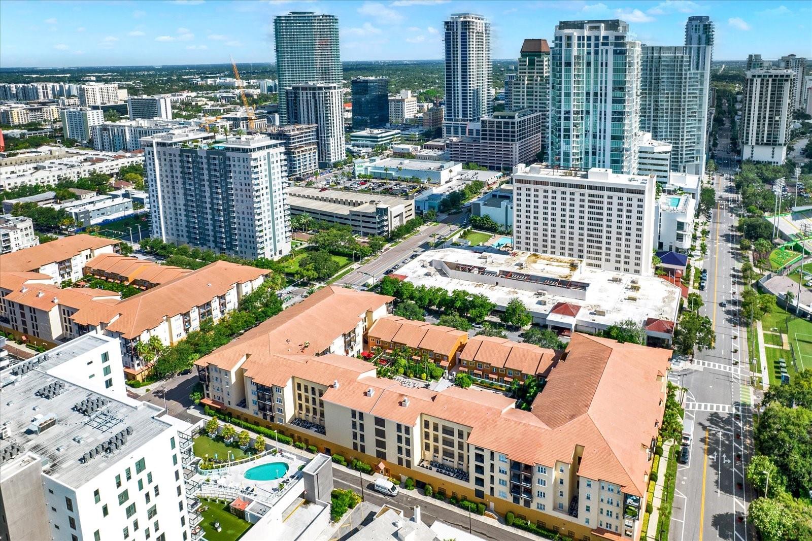 One or more photo(s) has been virtually staged. Welcome to Life at The Madison – where the energy of the city meets resort-style living! This 2-bedroom, 2-bath split floor plan condo at The Madison puts you in the heart of downtown St. Pete—just steps from the Pier, waterfront parks, award-winning restaurants, museums, and the Saturday Morning Market. As you step inside, the high ceilings and open concept floor plan set the stage for bright, stylish living. The thoughtfully designed split-bedroom plan ensures privacy, with the spacious primary suite offering a large walk-in closet and renovated en-suite bath. The guest room also boasts a generous walk-in closet and updated en-suite bath. The open concept kitchen and breakfast bar make it perfect for both everyday living and entertaining. Step outside onto your private balcony for morning coffee or evening relaxation while soaking in views of the tree-lined street and city skyline. Additional perks include an in-unit laundry room, a large private storage closet just outside your front door, and an assigned parking space in the secured under-building garage. This gated, pet-friendly community delivers resort-style amenities: a heated pool and spa with cabanas, an outdoor fireplace, BBQ grilling stations, clubhouse, fitness center, community social room, kayak and bike storage, and a lush private courtyard. Milestone inspection complete is complete with no pending assessments! Whether you’re seeking a full-time home, seasonal retreat, weekend getaway, or smart investment, this one checks every box. Easy walk to grocery stores, banks, waterfront parks, and an endless selection of top-rated restaurants and bars. With live music, theater, sporting events, and festivals happening year-round, there’s always something new to experience. This is more than a home—it’s a lifestyle. Schedule your private showing today!