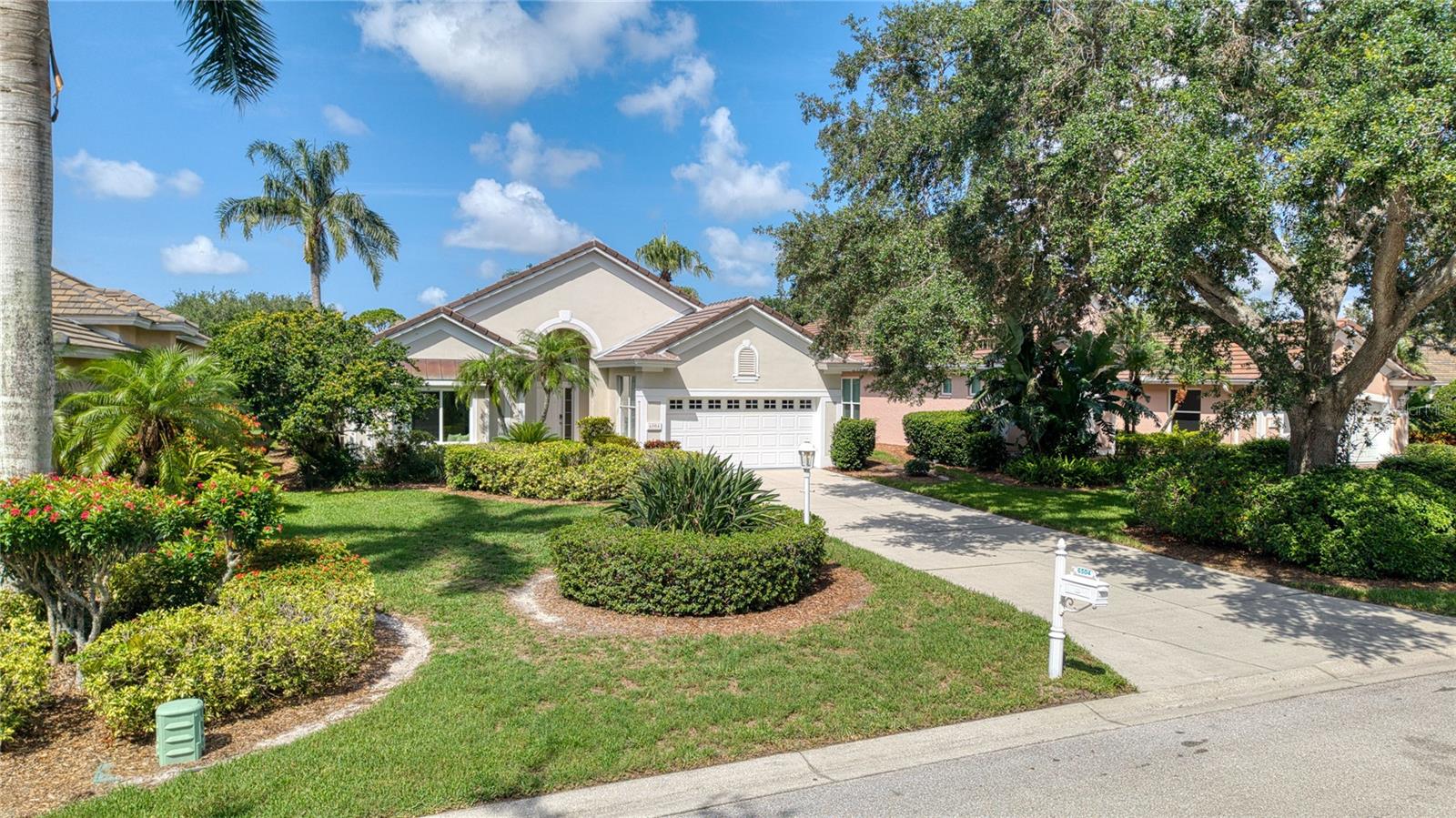 Step into a world of refined elegance in this meticulously transformed 3-bedroom, 2-bathroom single-family home, tucked away in the exclusive University Park Country Club. Designed for those who appreciate finer things, this stunning residence masterfully blends timeless style with modern luxury and functionality, all framed by gorgeous lake views that elevate everyday living.
Inside, let yourself be greeted by an open and inviting layout with soaring ceilings and abundant natural light. The entire home showcases exceptional craftsmanship, featuring new Level 5 smooth drywall finishes, fresh Benjamin Moore Chantilly Lace paint (2024), and continuous 24x12" French limestone natural stone tile floors throughout. A smart split bedroom plan ensures privacy.
The heart of this home is the fully redesigned and expanded chef’s dream kitchen (2024). It boasts rich Chocolate Maple Kraftmaid solid cabinetry with industrial drawer glides, sleek honed granite countertops with a full-height backsplash and ledge, and an oversized island with a charming fireclay farmhouse sink. Top-of-the-line appliances include a 48" Sub-Zero side-by-side refrigerator/freezer with a reverse osmosis filtered ice maker, a custom vent hood, a gas stove, and two new stainless-steel dishwashers. The kitchen also features a custom island pantry with pull-out trays, open shelving, and a wet bar with its own reverse osmosis water filter.
The primary suite is a serene escape, complete with a bay window showcasing tranquil lake views, a sliding door to the screened patio, and direct access to the outdoor space. The spa-like primary bathroom is a retreat in itself, featuring a custom solid Red Oak dual sink vanity, a curbless limestone shower with linear drain and handheld sprayer, marble accents, luxury polished chrome fixtures, and accessibility features. The second bathroom echoes this luxury with a new vanity and marble top (2024), curbless limestone shower, and equally exquisite finishes. Both bathrooms feature new fireclay sinks and all-new plumbing fixtures (2024).
Living in University Park Country Club provides access to resort-style amenities: an award-winning 27-hole Ron Garl designed golf course, tennis courts, pickleball courts, a cutting-edge fitness center, croquet, miles of tree-lined streets for biking, and world-class dining.
Professionally designed furnishings are available for separate purchase, offering a truly turnkey opportunity. Professional design services also available for move-in.
Check the 3D/360 virtual tour for more details.