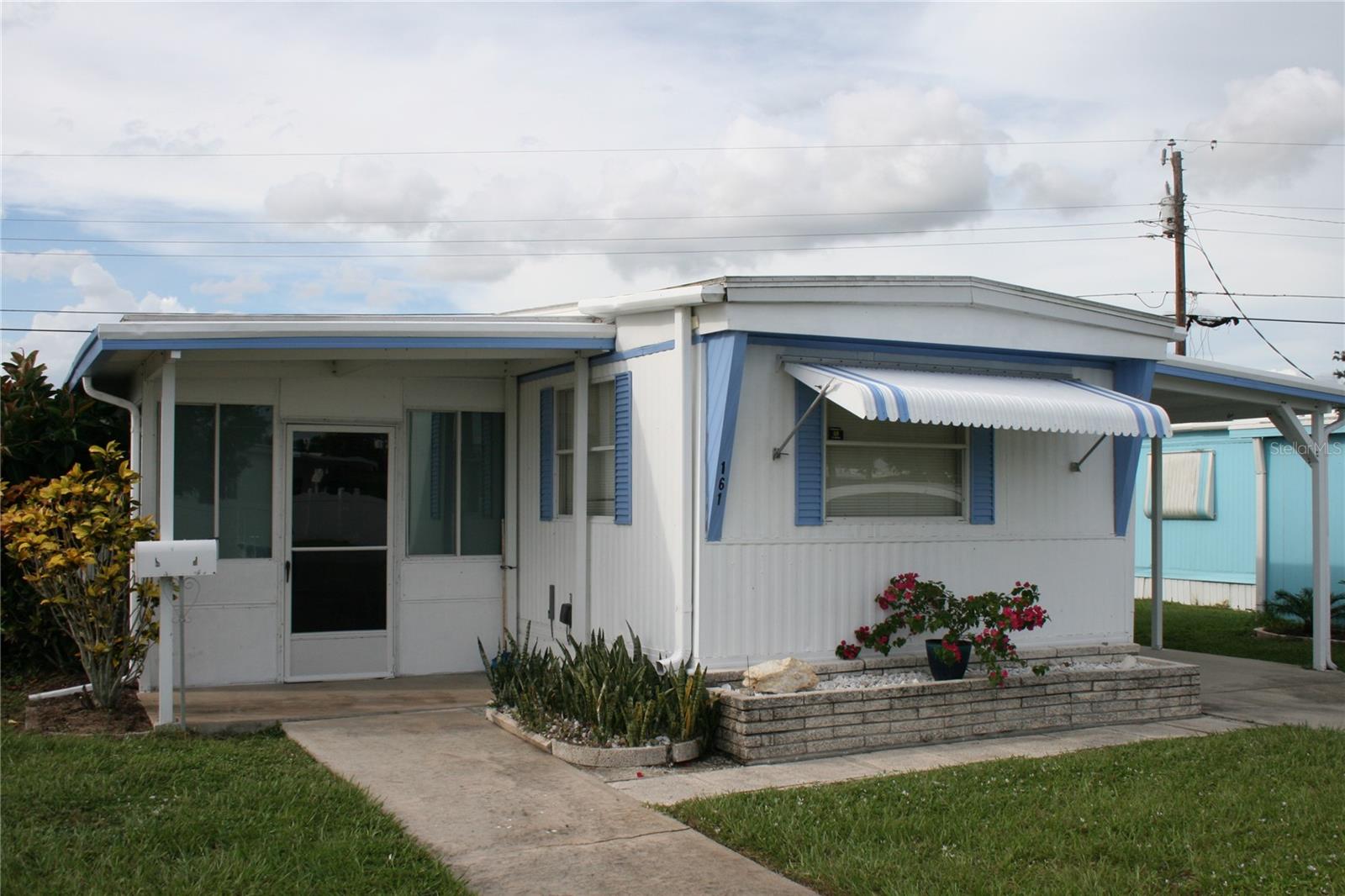 Welcome to your slice of paradise! Affordable living for the over 55 buyer. This 2 bedroom, 2 full bath unit is furnished, and located on one of the best lots in Oak Grove, with no units across the street, just green space! The kitchen has been recently remodeled, and all appliances remain. Kitchen is fully equipped with dishes, cookware, coffee pot and much more. Open floor plan with split bedrooms. The Florida Room and office have central air, increasing the square footage under air. The office could be converted into a great laundry room with extra storage. Washer and dryer are currently in the shed. Newer roof and the exterior was recently painted. Carport for covered parking, with a ramp to the door. Oak Grove is a friendly community with snowbirds and year round residents. Great location, under 4 miles to Manasota Beach; minutes to Venice; historic Dearborn St. in Englewood; farmer's markets; Wellen Park; shopping and restaurants. Golf courses and boating nearby. Enjoy the heated pool, shuffleboard, and rec center with activities.