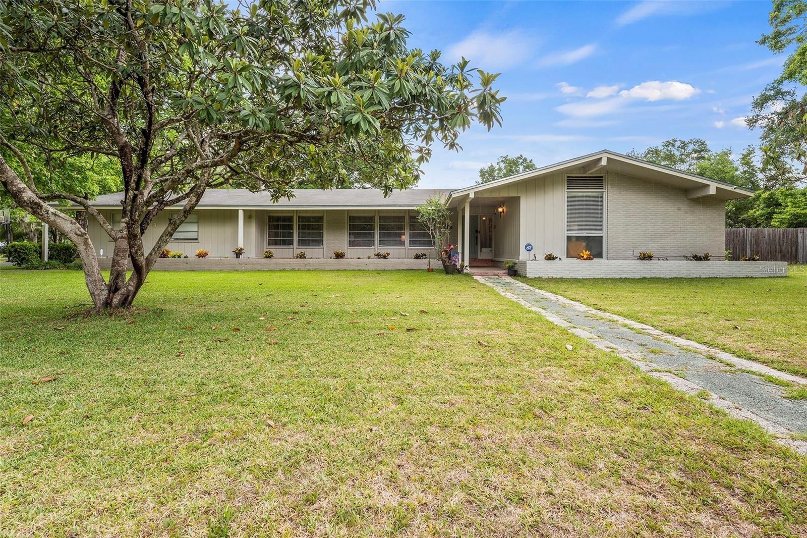 Large corner lot with fenced backyard. Expansive living area with living area open to dining area and Kitchen. Oversized covered back patio. Walk to historic downtown Newberry and all three public schools. Short commute to Gainesville, hospitals, UF and more.