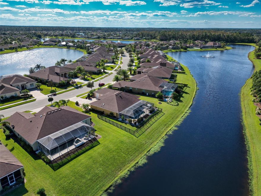 Discover your dream home in the sought-after PROMENADE PARKE AT VENETIAN BAY golfing community! First glance provides an impressive OVERSIZED DRIVEWAY with parking pad, 3-CAR GARAGE, and beautiful landscaping. The outdoor space includes a large COVERED PORCH and pool deck for plenty of room to enjoy those long summer days along with a CONCRETE PAD for grilling or a raised garden bed. Enjoy pool parties all year long as this SALT WATER POOL has SOLAR HEATING. The remaining yard is FENCED in without hindering your gorgeous WATER VIEW. This 3 bedroom, 2 bathroom, plus office SPLIT FLOOR PLAN has been meticulously maintained & cared for by its original owner. As you walk through the home, you will be greeted with an abundance of daylight and beautiful views of your new backyard oasis. With TILE FLOORING, PLANTATION SHUTTERS, and CUSTOM VERTICAL DOOR BLINDS throughout, this home has more than the average upgrades, including a beautiful WOOD PLANKED WALL in the family room. The front of the home includes an OFFICE with french doors that overlook the spacious kitchen, family and dining rooms. Just off the family room is the master bedroom which has a sliding door complete with CUSTOM BLACKOUT BLINDS that open to the generous sized POOL DECK and COVERED PORCH to bring the outside in! The master bathroom includes a DOUBLE VANITY, plenty of storage between the linen and walk-in closet, and an additional makeup vanity. The kitchen is the heart of this home with SOLID WOOD CABINETS, plenty of counter and storage space and a KITCHEN ISLAND to make all of your culinary dreams come true! There is a breakfast bar and eating nook for plenty of room that includes another sliding door to the pool deck. Off of the kitchen is the LAUNDRY ROOM with a UTILTY SINK and a large linen closet. Continue through the back of the house to find the remaining 2 bedrooms and a shared bathroom with an UPGRADED SHOWER and a door that leads to the pool deck. Within close proximity to beautiful NEW SMYRNA BEACH, boutique shopping, locally owned restaurants, and EASY ACCESS TO ORLANDO!  The Club at Venetian Bay offers a PUBLIC GOLF COURSE, CLUB HOUSE, SPA, and plenty of other amenities for a separate membership fee! Schedule your showing today!