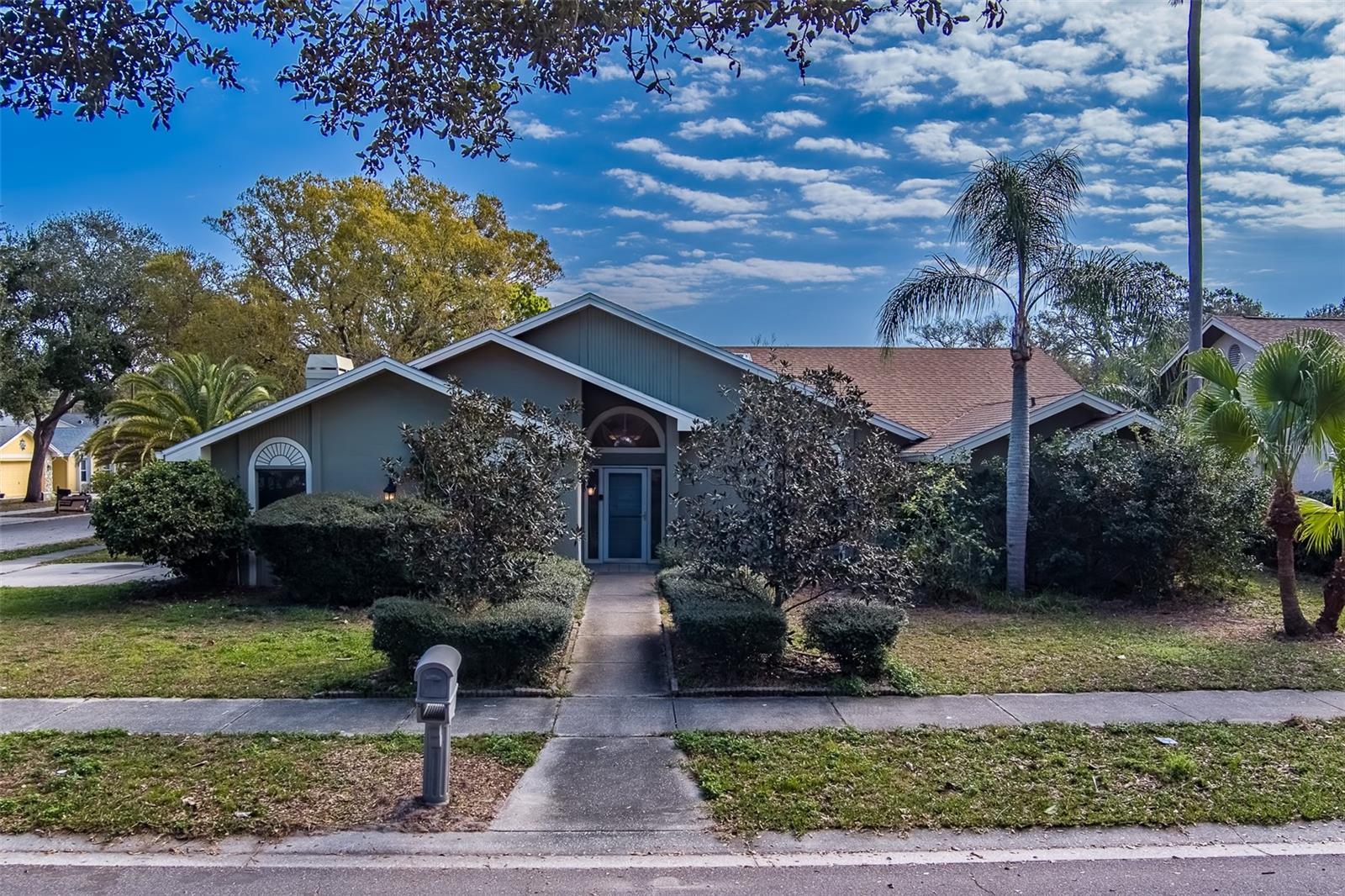 Discover your dream home at 1112 Woodcrest Avenue in the heart of Safety Harbor, Florida. This spacious single-family residence built in 1986 offers over 2,300 square feet of comfortable living space on a generous 88x112 lot. The home features an open floorplan ideal for entertaining, with five sets of sliding doors that lead to a lanai overlooking a pool, spa, and lush garden. The interior boasts 4 bedrooms and 2 full baths with tile, carpet, and hardwood flooring, plus an attached 2 car garage. Located in a desirable neighborhood this property is within close proximity to top-rated schools, including Safety Harbor Elementary School, Safety Harbor Middle School, and Countryside High School. Experience the perfect blend of comfort and convenience in this charming Safety Harbor home.