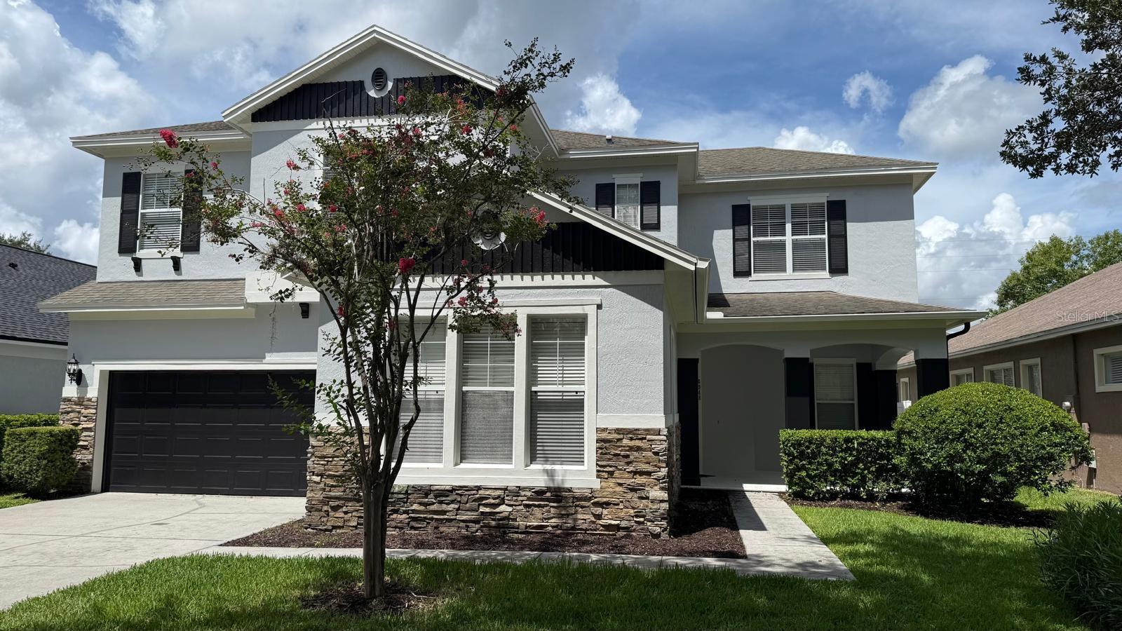 PRICED TO SELL! Stunning Home in Windermere – Nearly 4,000 Sq Ft! Welcome to this gorgeous 5-bedroom, 3.5-bath home with a private office/den, located in one of Windermere’s most sought-after communities and zoned for top-rated schools, including Windermere High School. From the moment you step inside, you’ll be captivated by the grand foyer, gleaming hardwood floors, and open-concept layout perfect for entertaining. The spacious family room is filled with natural light and seamlessly connects to the chef’s kitchen, featuring 42" wood cabinets, granite countertops, a butler’s pantry, and ample storage. Upgraded bathrooms, dual A/C units, pre-wired surround sound (family room, upstairs, and porch), and a large fenced yard add to the home's functionality and comfort. Enjoy community amenities including a pool, tennis and basketball courts, dock access, parks, and playgrounds. Just 2 miles from Disney’s Magic Kingdom – watch the nightly fireworks from your backyard! This immaculate, move-in-ready home offers the perfect blend of space, luxury, and location. Don’t miss this incredible opportunity – schedule your showing today!