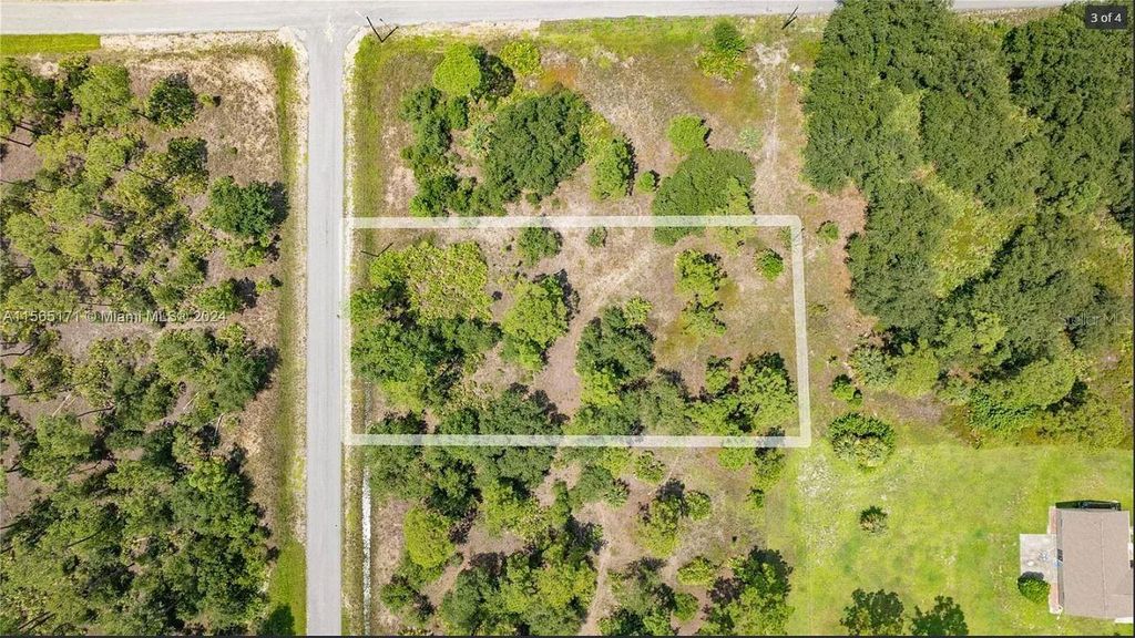 Photo of 1420 Clayton Avenue, Lehigh Acres, FL 33972 (MLS # O6343656)