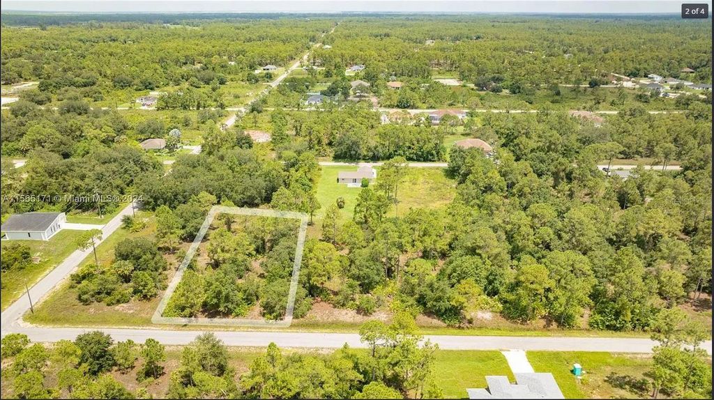 Photo of 1420 Clayton Avenue, Lehigh Acres, FL 33972 (MLS # O6343656)