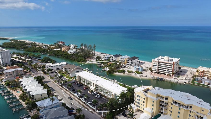 Introducing Inlet Apartments - Siesta Key—a charming, quaint coastal retreat for a tropical vacation or a beach get-away. This second floor, 1 bedroom 1 bath is truly quiet and peaceful on the Blind Pass Lagoon at the far south end of Siesta Key and just beyond your sliding glass doors. You will be instantly captivated by views of paddle boarders and kayaks paddling by, plus a heated swimming pool, and a partial view of the Gulf. With 906 square feet, this residence is sold turnkey furnished, blending modern sophistication with relaxed coastal living. Contemporary new kitchen: new appliances, white quartz countertops, an oversized island, crafted for effortless everyday living. The open-concept layout flows through dining room with (queen size Murphy bed for extra guests) and living spaces, enhanced by luxury vinyl wood flooring and modern compact ceiling fans that adjust with the touch of a button. Wake up to enchanting lagoon views in the tranquil primary suite, and beautifully updated bath. Step outside to a spectacular 200 sq. ft. screened lanai with pull down shades for privacy —ideal for morning espresso, sunset cocktails, or simply soaking in Siesta Key’s year-round beauty. There are convenient elevators, laundry facilities, and assigned parking for each unit. HVAC 2021, Water Heater 2022. Life at Inlet boating amenities included private boat dockage for sailboats and powerboats up to 26 ft. (first come first serve basis). The Blind Pass Lagoon leads into Sarasota Bay and onto the Gulf. There are fishing, kayak storage and launch, waterfront pool, just minutes from Turtle Beach and a short trolley ride to Crescent Key Village. This is more than a condo at the beach —it’s a one-of-kind opportunity to own a piece of Siesta Key.