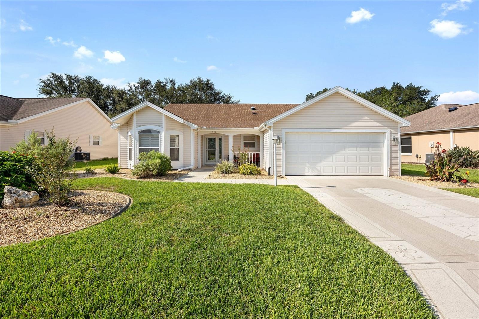 Welcome home to this enhanced Cypress (Vera Cruz) model OVERLOOKING the 8th green of the par 3 on the Hacienda Hills Lakes CHAMPIONSHIP GOLF COURSE. Your new home is in THE VILLAGE of Hacienda South nestled between Spanish Springs and Lake Sumter Landing. The Multimodal path is right behind the home giving you easy access to walking, jogging, bird watching, bike riding and golf cart touring as well as access to town squares and all the recreational offerings. This home is close to medical services, restaurants, and two different squares for shopping, dining and nightly entertainment, all by golf cart. Coming in just under 2000 sq/ft, this home has been meticulously maintained and is ready for you to begin your new adventure in The Villages. NO BOND~ NEW ROOF 2020 ~ NEW HVAC 2022 ~ DEEP GARAGE 24 and 1/2 FEET.... Luxury Vinyl Plank – NO CARPET. NEW garage door and opener, NEW front storm door. Stainless Appliances - PLANTATION SHUTTERS throughout. New whole house water filtration system. Solar tubes keep everything LIGHT and BRIGHT. Soft close cabinets in the kitchen where you'll find 2 additional rows of cabinetry for extra storage. QUARTZ countertops and cabinet pull-outs round out the kitchen upgrades. The primary owner suite has 2 walk-in closets - bathroom has plentiful cabinets, luxurious jetted tub along with a shower and double vanity with plenty of counter space and lots of natural lighting. The den overlooks the golf course with a custom closet organizer. Enter the rear lanai through leaded glass door - covered lanai with volume ceilings and cricket gutters drainage with an open screen area to enjoy the beautiful scenery and occasional good shot. The laundry room is inside and features a crafts table or desk. Outside, you'll find pleasing landscaping with lush green grass, Florida palms and a beautiful view of the golf course.