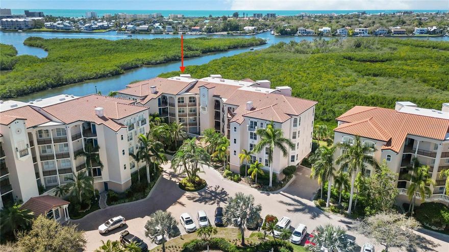 One or more photo(s) has been virtually staged. ***   Aggressive Price Drop ~ Seller is "ready to make a deal!!"   ***        "Welcome to 5430 Eagles Point Circle, PH unit 402, a breathtaking top floor residence nestled in the coveted enclave of Eagles Point at The Landings. This 4th-floor gem offers an unparalleled living experience with stunning panoramic views of the Intracoastal Waterway, Phillippi Creek, not to mentioned captivating sunsets!

Boasting a thoughtfully designed 3-bedroom, 2-bath layout, this residence welcomes you with an open and spacious split floor plan illuminated by abundant natural light pouring in through expansive windows and doors. Step out onto the covered/screened lanai to savor the picturesque water and wildlife vistas.

The kitchen is a chef's delight, featuring newer stainless Bosch and Kitchen Aid appliances, a designated breakfast nook, ample wood cabinetry, and ceramic tile floors. The living and dining area, adorned with beautiful hand-scraped hardwood floors, creates a seamless flow perfect for entertaining. Lanai access allows you to extend gatherings outdoors while enjoying the mesmerizing views.

The owner's suite is a private retreat with lanai access, panoramic water views, and a spacious ensuite bath complete with a soaking tub, separate shower, dual sink vanity, and a generously sized walk-in closet. The guest area encompasses light-filled rooms with hardwood floors, ample closets, and ceiling fans, accompanied by a well-appointed guest bath.

This top floor unit boasts 10' ceilings, crown molding, the convenience of an in-unit laundry area, and a dedicated garage parking space and lockable storage!  As part of The Landings, a 24-hour guard-gated community west of the trail, residents enjoy proximity to Siesta Key's renowned beach and downtown Sarasota's cultural delights, shopping, and restaurants.

Additionally, ownership includes membership to the Landings Racquet Club, offering eight Har-Tru tennis courts, fitness rooms, a clubhouse for social events, a Jr. Olympic-sized heated pool and spa. Immerse yourself in nature with walking trails leading to a dock and gazebo overlooking the Intracoastal Waterway. Kayak enthusiasts will appreciate the convenience of storage on the nature path, and Phillippi Harbor dry storage boat facility is just a short distance away.

Don't miss the opportunity to make this remarkable penthouse unit yours. Call the listing agent today to schedule a private viewing and embrace the luxurious lifestyle that awaits at 5430 Eagles Point Circle.