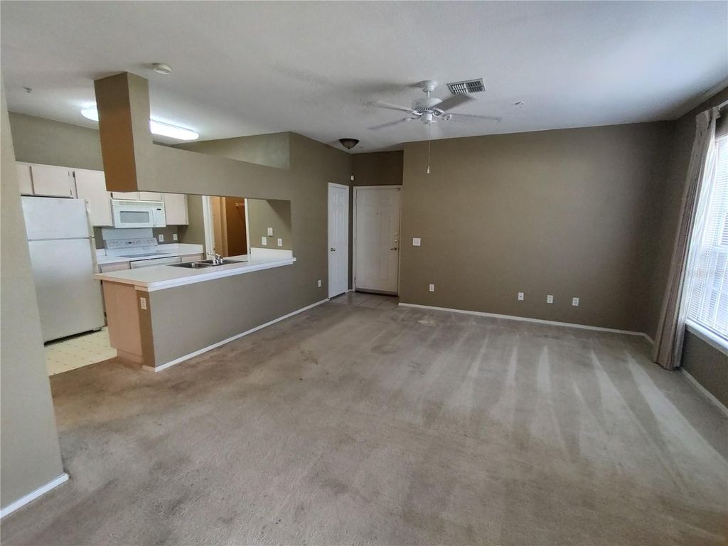 Photo of 13005 Sanctuary Cove Drive #103, Temple Terrace, FL 33637 (MLS # TB8459067)