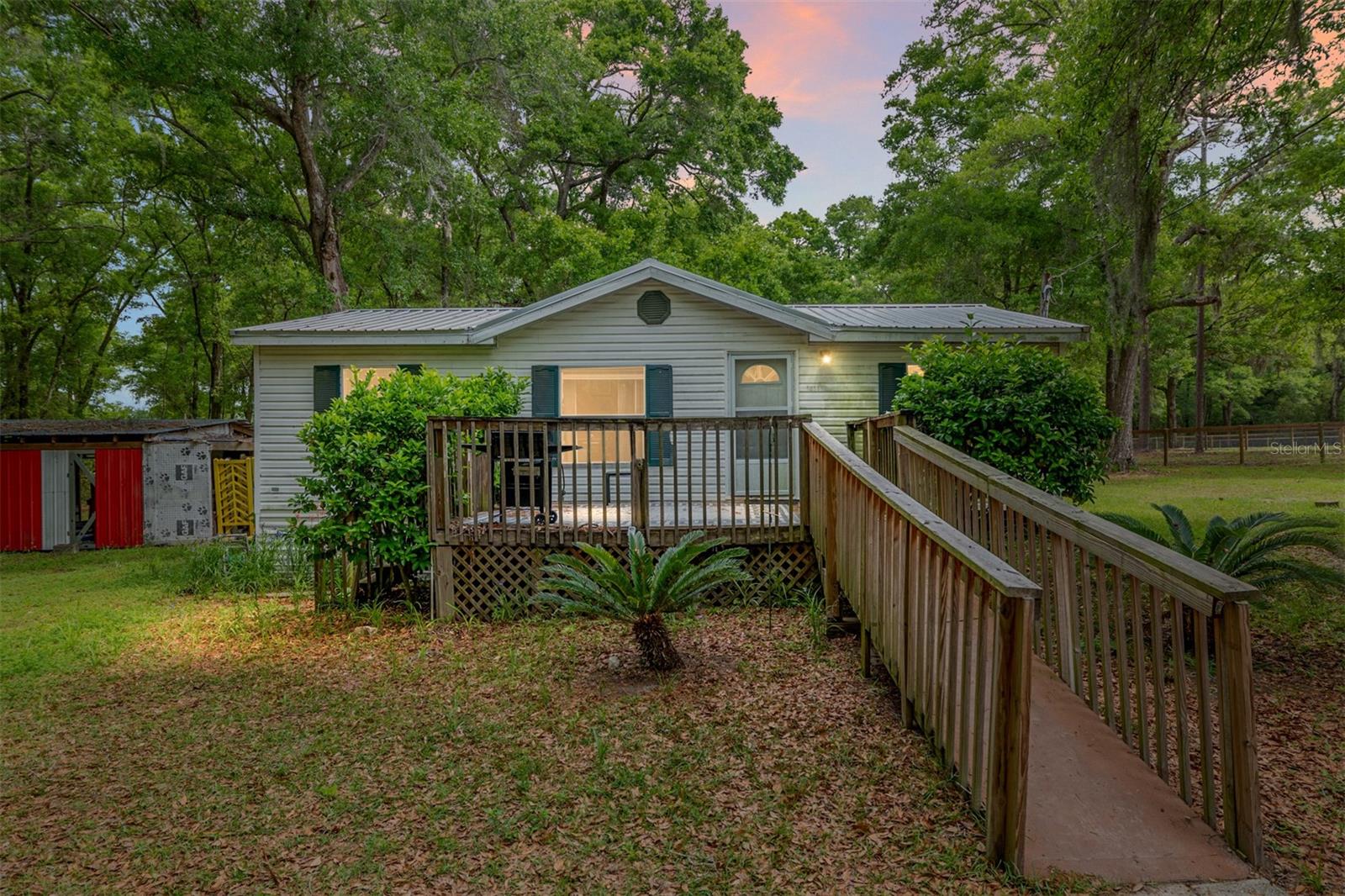 LOCATION, LOCATION, LOCATION! Short term Farm rental near WEC and HITS, April -Dec! Welcome to this beautiful farm rental featuring 10 plush acres, perfect for the horse enthusiast! Nestled mere minutes from the prestigious World Equestrian Center, this property features a 4 bedroom 2 bath beautiful mobile home, 15 New stalls (12x14), 8 plush paddocks, and a fabulous GGT Arena! The 4 bedroom, 2 bathroom home comes FULLY FURNISHED with beautiful LVP flooring throughout! An open-concept floor plan creates an inviting atmosphere, perfect for both family living and entertaining equestrian connoisseurs. The kitchen features solid wood cabinetry, beautiful countertops, a dining room table and plenty of storage space, equipped with everything you need! The primary suite is great in size, complete with an en-suite bath, while additional generously sized bedrooms and a beautifully appointed guest bathroom catering to every need. Immerse yourself in breathtaking views of the landscaped grounds and the serene paddocks. Experience the ultimate in equestrian lifestyle with an unbeatable location! Available for long or short-term lease. Inquire today!