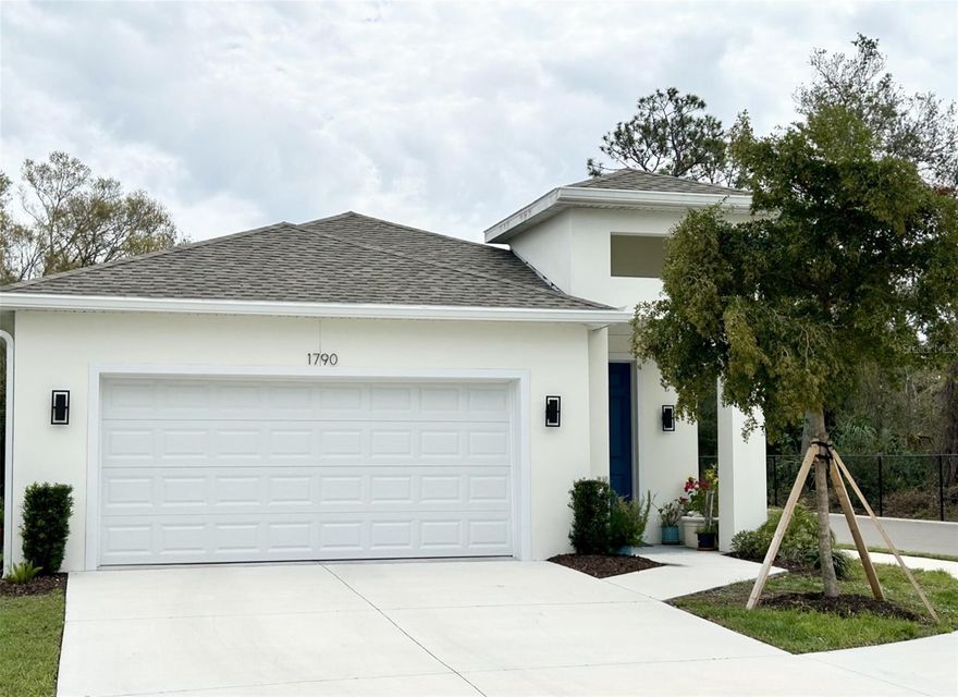 This charming Sarasota residence built 3 years ago in the gated community of Hammock Place offers meticulously designed living space on a single floor. The home features three bedrooms, including a spacious primary suite and two well-appointed bathrooms. The upgraded kitchen is a highlight, showcasing crisp white (soft closure) cabinetry, GE Profile stainless steel appliances, granite countertops, a striking marble backsplash and bar seating at the island. The dining area exudes elegance with a crystal chandelier creating a unique ambiance. Luxury vinyl floors run throughout, complementing the light airy feel of the rooms. Large windows in the living area and bedrooms allow ample natural light and offer views of the surrounding greenery. The bathrooms feature contemporary fixtures and marble inspired tiling. This home seamlessly blends an open floor plan for comfort and style, with thoughtful details like ceiling fans and recessed lighting enhancing its appeal. In addition, other features that this exceptional quality home offers are high ceilings (9'5"), ICF's insulated concrete walls, hurricane rated impact glass windows and doors, 2 car garage with cabinet storage space and an extra refrigerator. Hammock Place is a gated and deed restricted community of 40 homes conveniently located near Bobby Jones Golf Course, Sarasota Lawn Bowling Club, Nathan Benderson Park, University Parkway for local dining, shopping, UTC Mall, healthcare facilities, SRQ airport, downtown Sarasota, Lakewood Ranch Main Street, our famous beautiful white sand Gulf Beaches (Lido 8mi & Siesta Key 11mi), Ringling Museum and many other attractions nearby. Schedule your private showing today, you won't be disappointed!