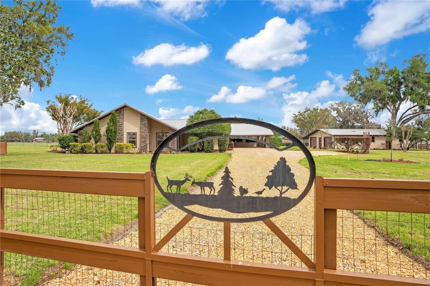 One or more photo(s) has been virtually staged. Tucked away at the end of a quiet cul-de-sac of custom homes, this meticulously maintained rural retreat offers space, privacy, and charm on 1.88 acres in desirable Plant City. With 4 bedrooms, 2 bathrooms, and 2,928 square feet, the home features a beautifully updated kitchen with abundant counter space and a picturesque window overlooking peaceful pasture views from the neighboring Brahma cattle ranch. Designed for both relaxation and entertaining, you’ll love the expansive 19’x19’ family room and the light-filled 19’x19’ game room surrounded by windows. Step outside to enjoy the paver patio with fire pit, perfect for quiet evenings under the stars. The fully fenced property includes a detached 29’x45’ garage/workshop with three roll-up doors, power, a/c and water, along with a storage shed and two wells for added convenience. A 2-car carport provides additional covered parking. Recent updates include a 2019 roof, 2022 HVAC system, new Luxury Vinyl Plan (LVP) flooring in 2026 and fresh interior paint in 2026. The landscaping has been thoughtfully refreshed, with stunning azaleas and crepe myrtles lining the front fence, creating inviting curb appeal. With no HOA, no CDD, and no deed restrictions, this peaceful, super quiet property offers the freedom to truly make it your own while enjoying the beauty of country living.