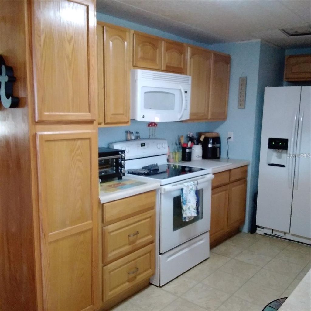 Photo of 10473 Holiday Shores Drive #303, Largo, FL 33773 (MLS # TB8521688)