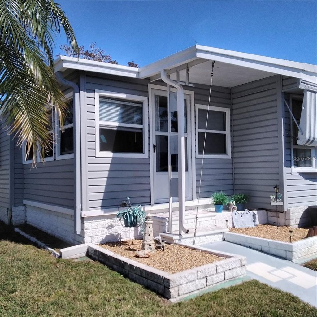 Photo of 10473 Holiday Shores Drive #303, Largo, FL 33773 (MLS # TB8521688)
