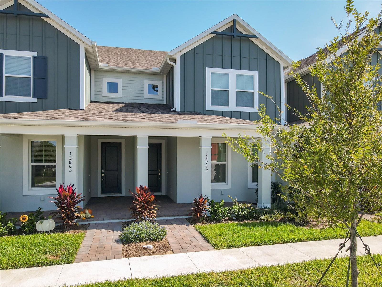 Luxurious brand new townhome with 2 primary suites and 1 additional bedroom downstairs, each with its own full bathroom. The open-concept living and dining area features upgraded flooring and a gourmet kitchen with solid surface countertops, stainless steel appliances, 42" cabinets, large pantry, and stylish lighting. Enjoy outdoor living on the balcony and enclosed covered lanai with a private fenced yard. Additional features include energy-efficient construction, dual-pane windows, smart home technology, two-car garage, and full gutters. Ideally located 2 miles from Flaming Crossings (Target, Starbucks, restaurants) and minutes from the Hamlin dining area. The community offers a pool, cabana, playground, and dog park, providing comfort, convenience, and lifestyle amenities.