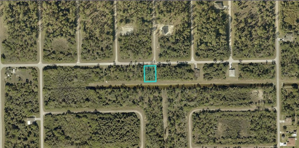 Photo of 1226 Ravenswood Street E, Lehigh Acres, FL 33974 (MLS # A4685761)